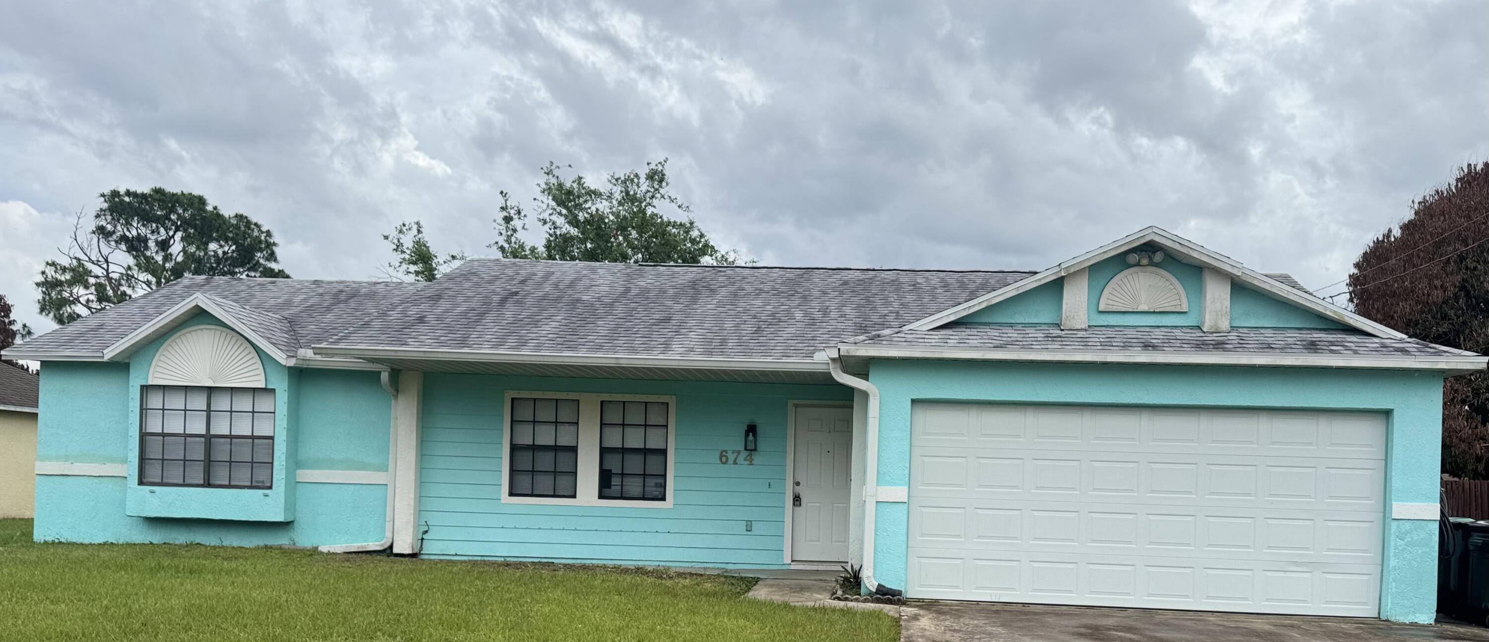 This 3-bedroom, 2-bath home features vaulted ceilings which create a bright   open feel, while the pass-through kitchen overlooks the spacious screened patio-perfect for relaxation or entertaining. Recent updates include a 2020 roof, 2017 A/C and new water heater.  The interior has been freshly painted and thoughtfully upgraded with new baseboards, vinyl flooring, and refreshed bathroom vanities/sinks. The kitchen has a functional layout featuring a quartz countertop island, ideal for entertaining and everyday living.  The primary suite offers a comfortable retreat with a walk-in closet. Situated on an oversized lot with a 2 car garage, NO HOA. Quick access to both major north -south highways.    The home is vacant and ready for immediate occupancy.