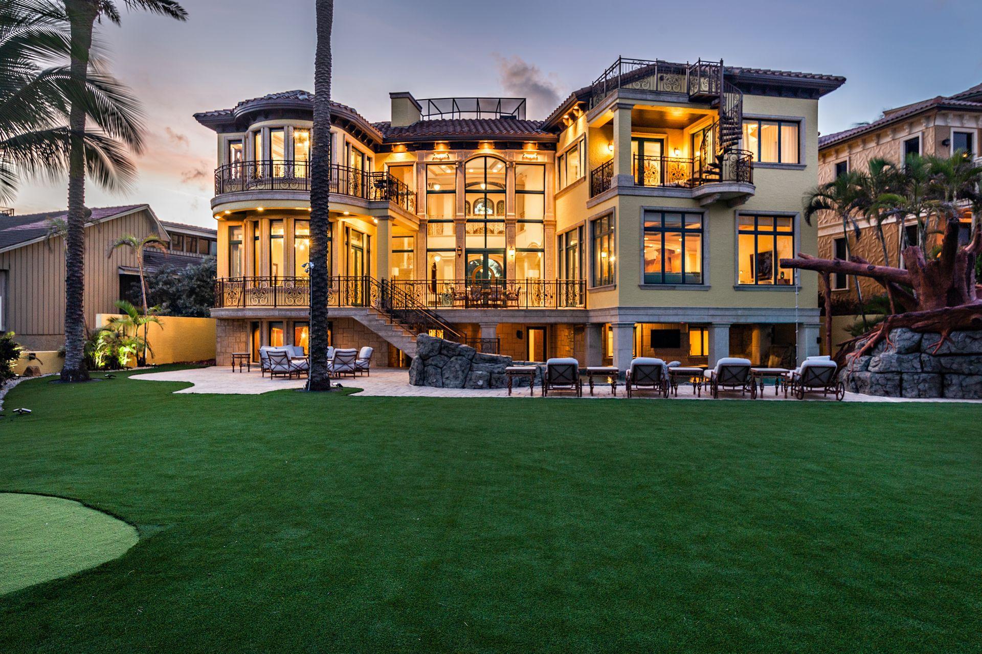 PROPERTY IS RENTED TIL APRIL 30, 2020. Sited on over a ½ acre oceanfront lot, this estate with private elevator has magnificent ocean, Hillsboro Inlet and lighthouse views from all main rooms. The manicured backyard feels like a five star resort complete with putting green and tropical palms that enhance its beachfront locale. This 2004 estate with 7,962 square feet of air-conditioned living space, has been recently renovated with brand new roof and interior designer finishes. Stone floors, hurricane impact windows and doors throughout, private 7-seat home theater & game room, and a gym. 
The property was part of a trade so that the sold price may not accurately depict the actual value of the home