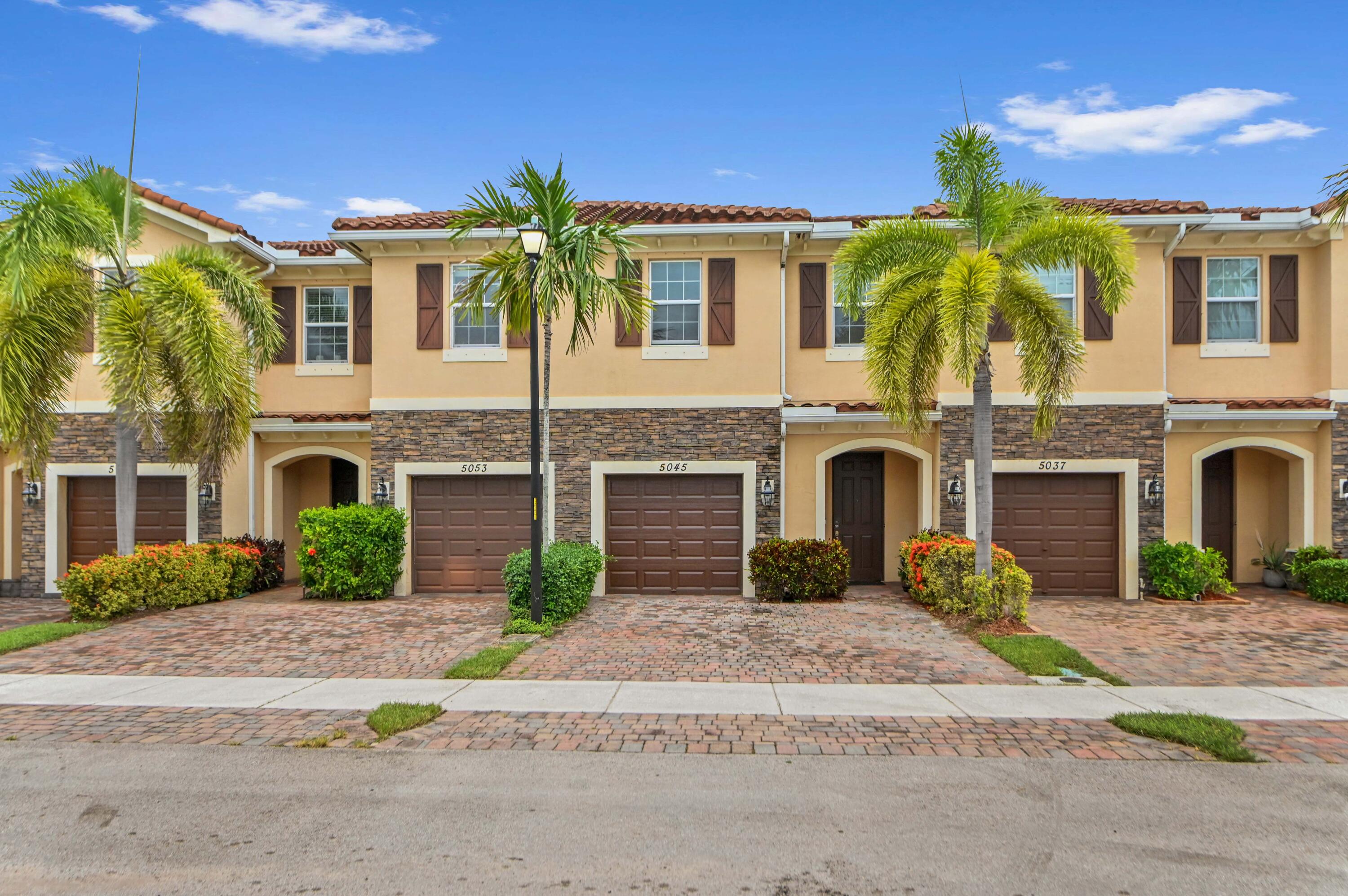 Welcome to this charming townhouse in Charleston Commons, West Palm Beach, offering 1,673 square feet of thoughtfully designed living space. This two-story residence features 3 bedrooms, 2 full bathrooms, and a convenient half bath, along with a welcoming foyer and an attached one-car garage. Tile flooring flows throughout the main living areas, including the foyer, open concept kitchen, dining, and living room, while the staircase and all bedrooms feature comfortable carpeting. The spacious kitchen is equipped with ample cabinetry for storage, a center island with bar seating, and appliances that make meal preparation and entertaining a breeze.    The well-designed floor plan provides comfortable spaces for everyday living, making this home an excellent opportunity for those seeking low-maintenance living in the desirable Charleston Commons community.