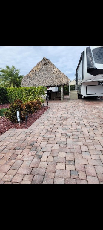 Silver Palms Rv Resort, Bring your RV and enjoy all that this 5bstar gated community has to offer. 1/4 North Of Lake Okeechobee. Clubhouse with daily activities, pickleball, poolside bar and cafe, billiard, card, library and fitness center. Pet friendly. May be rented when  not in use. Site will accommodate Class A, C or 5th wheel. Motivated seller.  Finished casita and tiki