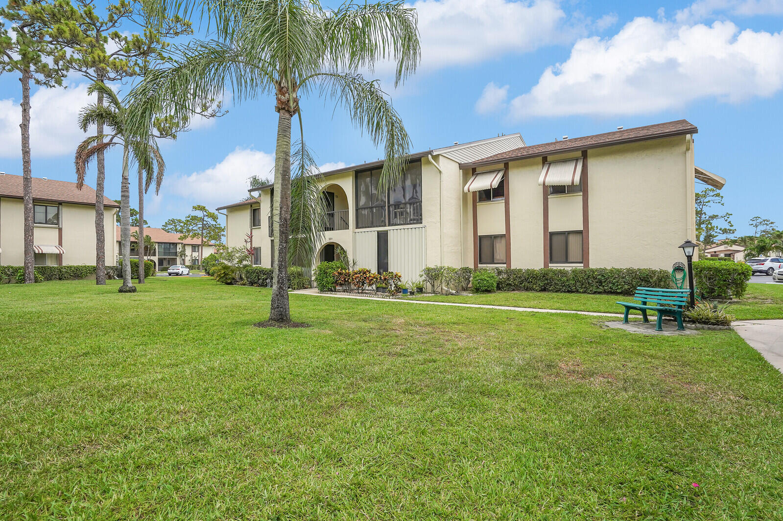 This move-in ready 2 bedroom, 2 bathroom ground-floor corner unit is move in ready! Inside, you'll find a peaceful garden view, 2024 water heater, 2023 A/C,  plus newer stainless steel appliances. With neutral paint and tile flooring throughout, the light-filled, thoughtfully designed layout includes a screened-in patio perfect for enjoying the Florida breeze, large walk-in closets, an interior laundry space, and plenty of additional storage. Even better? The community installed a BRAND NEW ROOF in 2025 - with no special assessment to owners AND the Association fees in 2026 are being REDUCED from $1738.00 to $1337.76 per quarter! Just steps from the clubhouse and centrally located within the community, this unit combines comfort, convenience, and low-maintenance living. Close to shopping, dining, major highways, and just 20 minutes from Palm Beach International Airport, this charming condo is perfect as a seasonal getaway or full-time Florida home. Located in the friendly and well-maintained community of Pine Ridge III South, this active adult neighborhood offers a relaxed South Florida lifestyle with amenities that include tennis courts, a heated pool, pickleball, shuffleboard, a vibrant clubhouse, friendly neighbors and more. The association is known for being well-managed and financially stable, offering peace of mind for both seasonal and year-round residents.