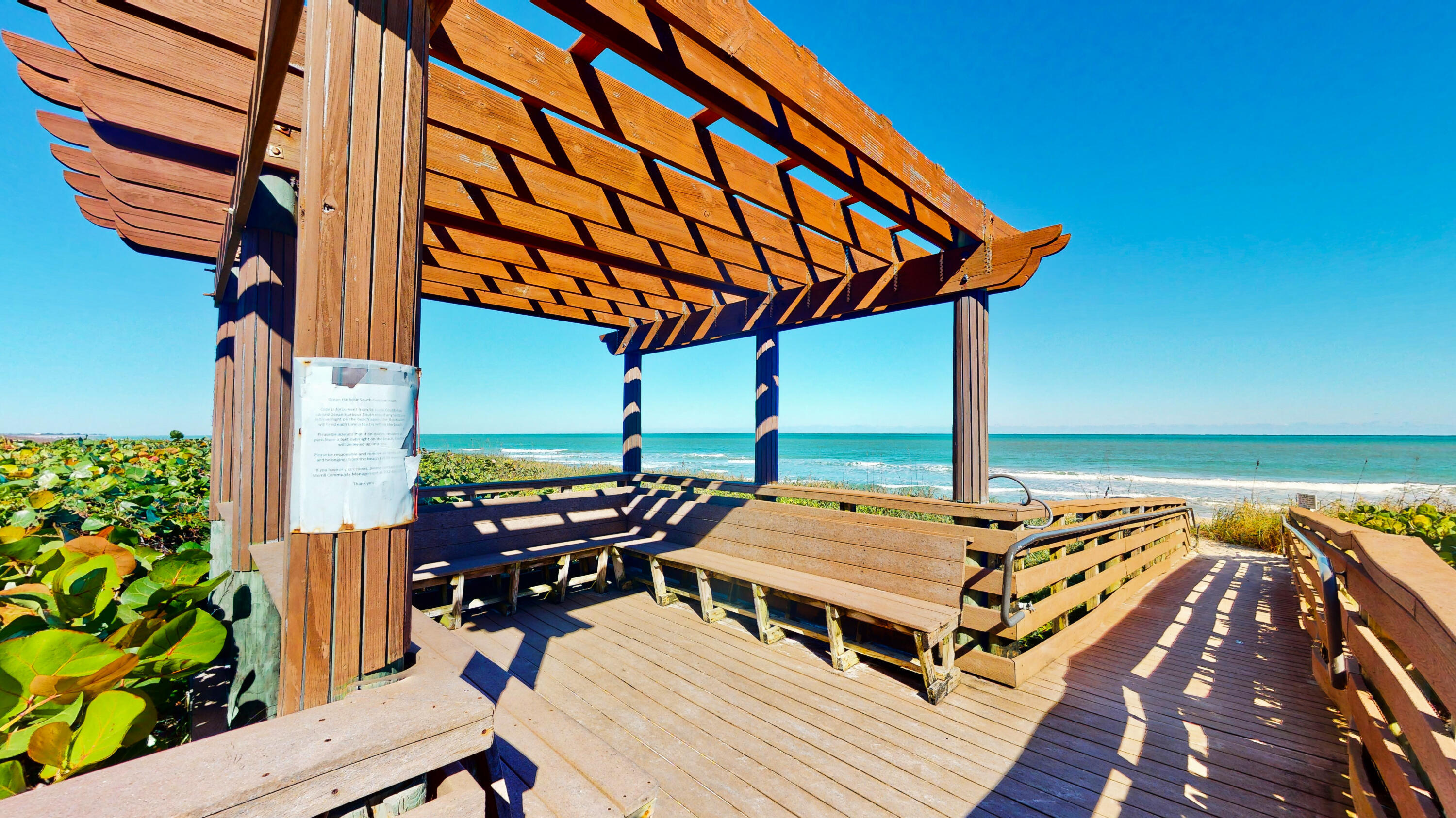 Charming Beachside Living Awaits at Ocean Harbour Villas!  Discover your own slice of paradise in this charming, beautifully maintained corner townhouse—located just steps away from the pristine beach. Features 2 bedrooms, 1.5 bathrooms, ample closet space & generous storage, plus convenient dedicated parking right outside. Step out onto your private, welcoming patio—the perfect spot for evening barbecues and entertaining friends in the ocean breeze. Living here feels like a permanent vacation with fantastic community amenities, including a sparkling pool, tennis courts, and direct ocean access...Bonus for Savvy Buyers: The monthly maintenance fee is remarkably low and covers your building insurance, sewer, trash, and water—offering ultimate peace of mind & effortless coastal living!