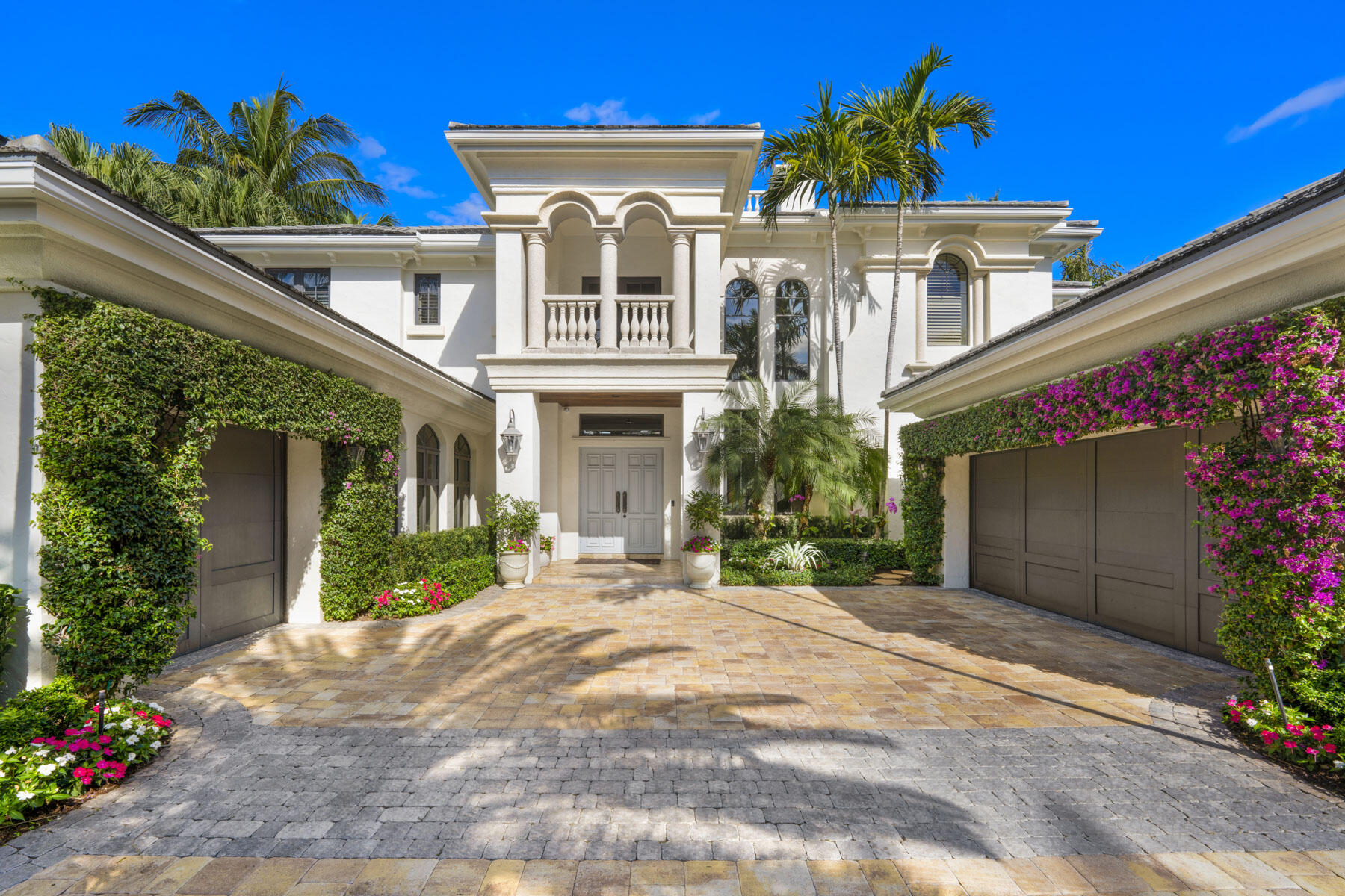Enjoy quintessential coastal living in this Mediterranean style deep water estate, located in Ocean Harbour Estates, the only gated waterfront community east of the Intracoastal and just steps to the beach in Ocean Ridge. This exquisite 4 bedroom, 4.1 bath home offers a 70' dock along 99' of water frontage nestled on a tropical oasis of meticulously manicured grounds. Boasting dramatic living spaces throughout and designed to meet the modern family requirements for tranquility and quiet sophistication, luxury amenities include a grand entry foyer, a great room with sunshine cascading from the two story windows, gas fireplace, wet bar, and pecky cypress beamed ceiling. A sleek modern kitchen, with high end appliances opens to a bright and airy family room with dining nook that seamlessly connects the outdoor summer kitchen making al fresco dining a dream. Tropical breezes and swaying palms caress the patio/pool/spa and creates a haven that no one wants to leave.