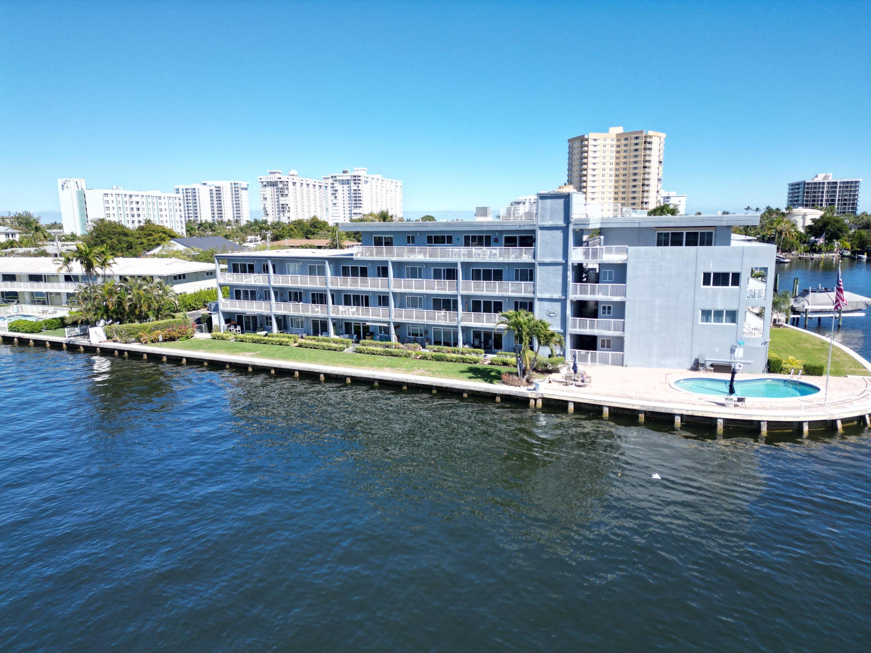 Corner waterfront condo with sweeping Intracoastal views and abundant natural light. Fully remodeled modern coastal 1BR/1BA just minutes from the beach. Bright open layout featuring impact windows, recessed lighting, motorized roller shades, and wood-look flooring throughout. Modern kitchen with stainless steel appliances, quartz countertops, and updated cabinetry. Flexible office nook adds extra functionality. Spacious bedroom with custom barn-style doors, walk-in closet, and renovated ensuite bath. Near the Pompano Beach Pier, Water Taxi, dining, shopping, boating, and entertainment. Heated pool and beautifully maintained grounds. Immediate rental flexibility. CASH ONLY. Schedule your private tour today! Modern kitchen with quartz countertops and updated cabinetry. Converted office nook provides flexible space for work or guests. Bedroom includes custom barn-style doors, walk-in closet, and renovated ensuite bath.