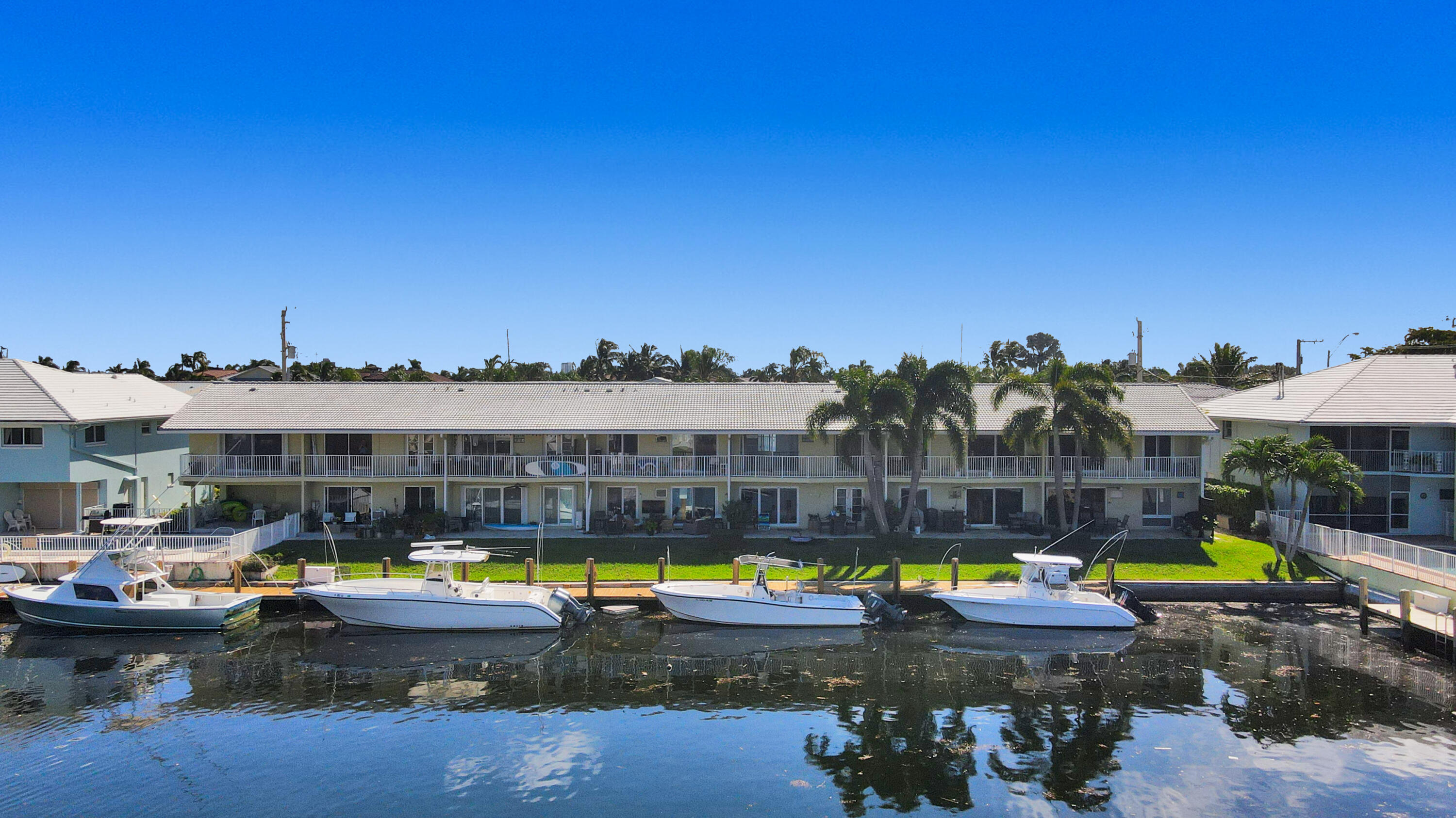 South Florida waterfront comes to life with this beautifully updated, light-filled 2 bed/1 bath condo in the highly desirable Hampton House of Lighthouse Point with DOCK SPACE. This inviting 2nd floor residence delivers captivating views of the Grand Canal, framed by multi-million-dollar homes, no fixed bridges, available dockage, & direct ocean access—an ideal setup for boating enthusiasts. Open-concept layout is drenched in natural light & features an updated kitchen, convenient washer/dryer combo. Newly installed hurricane-impact windows & doors offer added comfort and peace of mind. Enjoy morning coffee or sunset views on your private balcony, dedicated storage unit. Minutes from Hillsborough Inlet, premier shopping, dining, and popular waterfront destinations. Condo can be rented  one year of ownership.  Lighthouse Point features a tennis center, 4 parks, pickle ball and so much more!