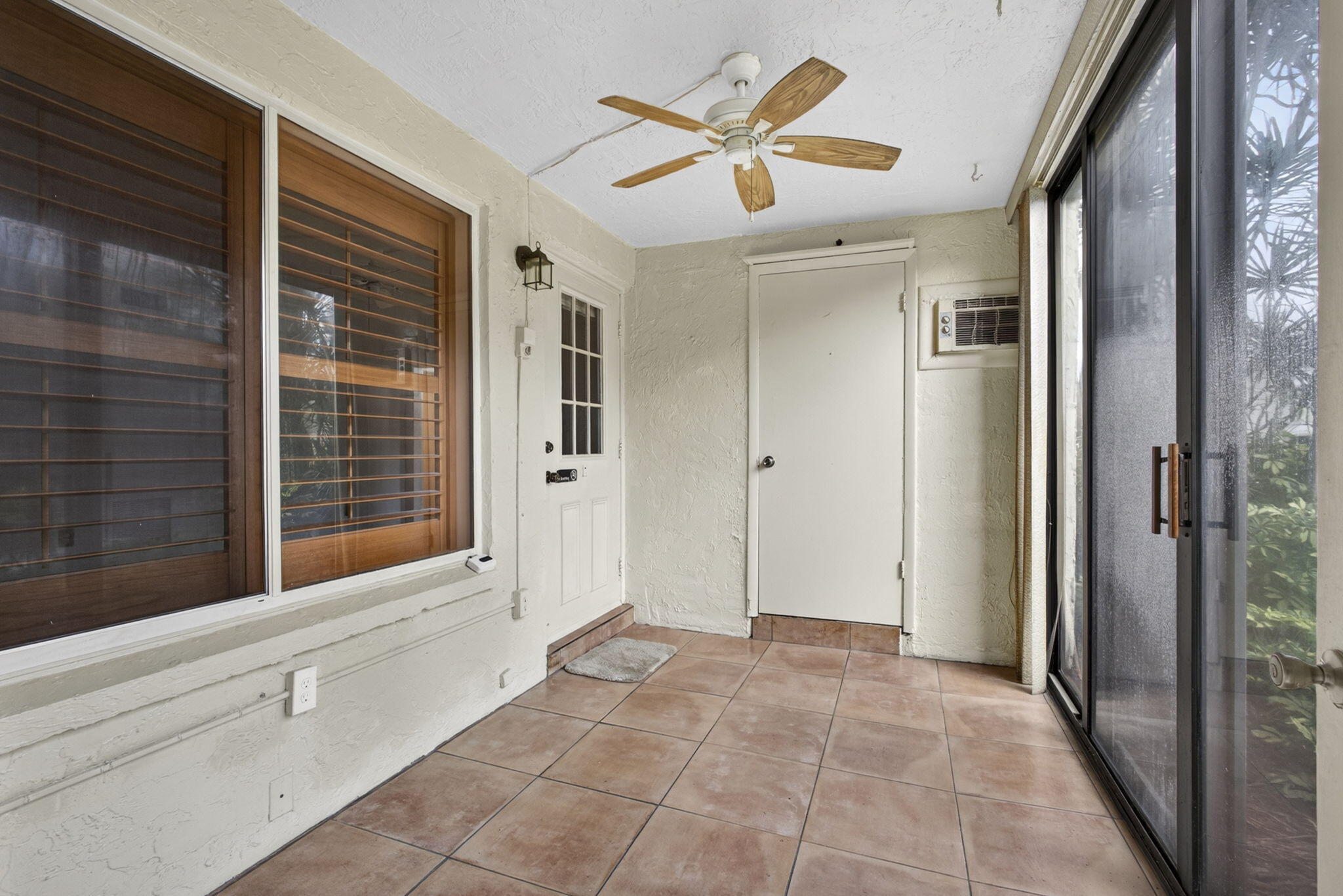 Welcome to Pine Ridge III, a vibrant 55+ no-pet community. Residents enjoy a clubhouse, sparkling pool, shuffleboard, bocce, and pickleball courts, with a scenic lake, complete with a walking trail. This updated 2-bed 1-bath first-floor corner unit offering comfort, style, and convenience. This move-in ready condo features a 2018 A/C system, updated kitchen cabinets and countertops, Whirlpool dishwasher, and garbage disposal. Interior upgrades include updated flooring throughout and fresh paint in every room. The remodeled bathroom showcases an updated vanity, toilet, and a tiled walk-in shower with elegant glass door and floor-to-ceiling tile finishes. Enjoy the charm of Bahama shutters. Ideal first-floor location with corner-unit privacy and easy access.