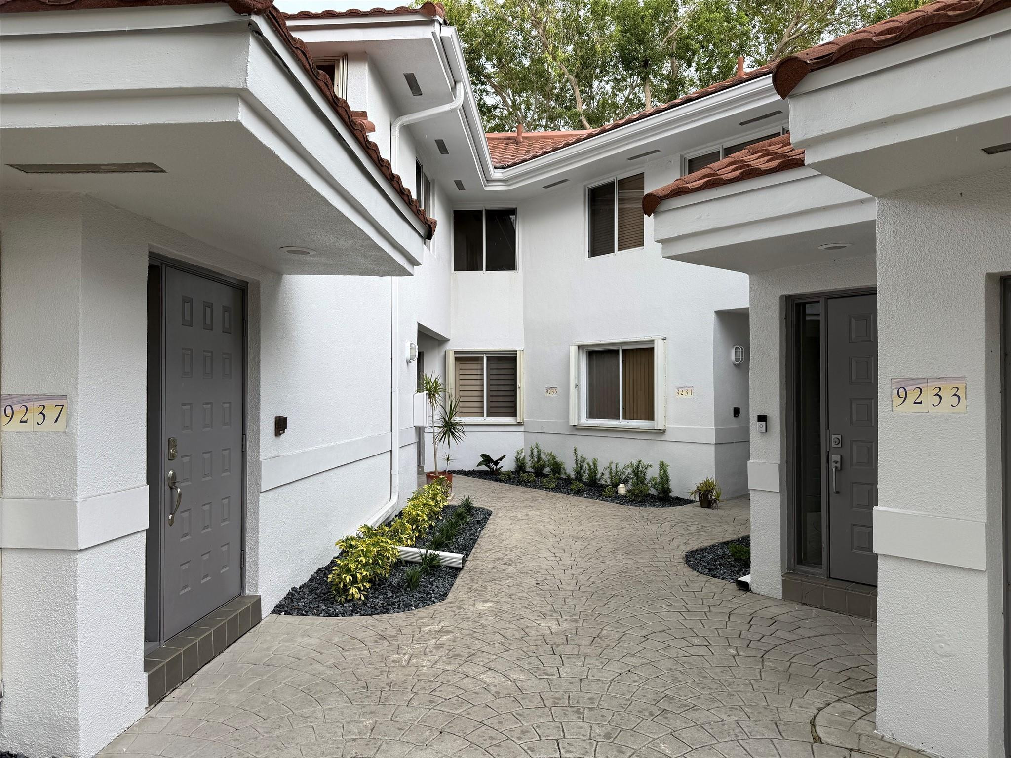 This 2-bedroom, 2-bath townhouse offers modern upgrades, vaulted ceilings up to 13 ft and serene PRIVATE canal views in a lush community. This well-maintained neighborhood of 205 units features a pool, lounge area, and walking paths for pets. The home includes a freshly painted ground-floor garage with stairs leading to the living area, an updated private balcony, NEW knockdown ceilings (no popcorn), wood floors, large tiles in the kitchen, granite counters, NEW Samsung stainless appliances, and soft-close cabinets. Smart features include an Alexa-compatible patio light and patio fan plus the garage door opener. NEW A/C, NEW updated PEX plumbing, and a NEW garage door opener providing comfort and efficiency. Appliances approx. 3 years old (Samsung stainless steel). A/C approx. 1.5 years old. Plumbing updated with PEX approx. 3.5 years ago. Brand new garage door opener. All ceiling fans and light fixtures have been replaced. Interior freshly painted; ceilings updated from popcorn to knockdown. Lots of new additions for a 30+ year old home!