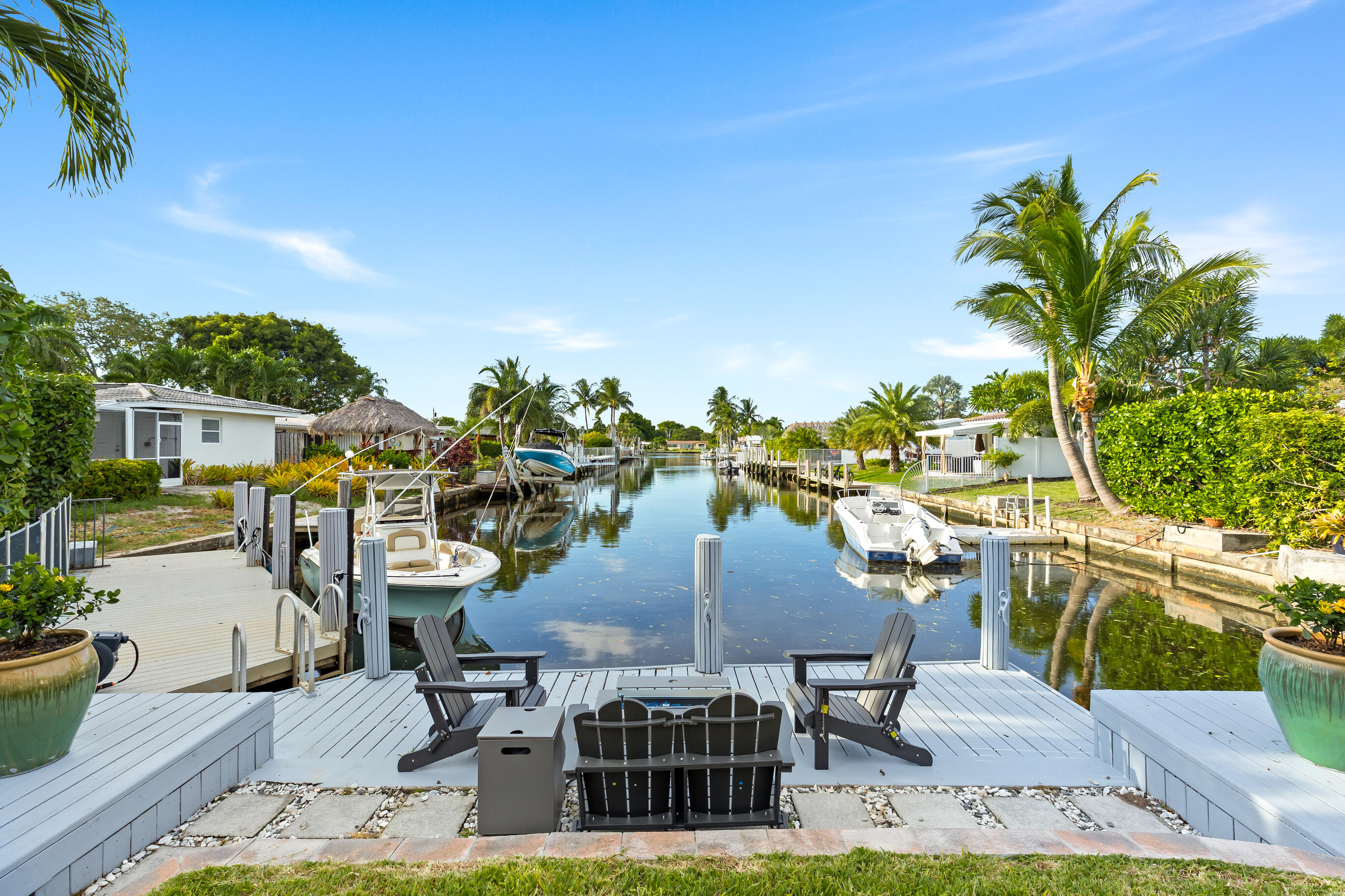Experience waterfront living at its finest in this beautifully maintained ocean-access home featuring stunning direct water views from most rooms. Located just 2 miles from the beach, this spacious residence offers 3 bedrooms plus a dedicated office, 2 bathrooms, and an outdoor shower for the ultimate South Florida lifestyle. Enjoy an open and inviting layout with tile flooring throughout, French doors, plantation shutters, and an eat-in kitchen perfect for everyday living and entertaining. Step outside to your private backyard oasis featuring a sparkling pool, expansive patio area, and 31 feet of waterfront with a private dock. Boaters will appreciate the easy ocean access with only one fixed bridge to the Intracoastal. Additional features include a newer A/C and water heater, garage, stamped concrete paver driveway, sidewalks throughout the neighborhood, and a prime location close to parks, shopping, dining, and I-95. No HOA and no restrictive approvals make for an easy move-in experience.