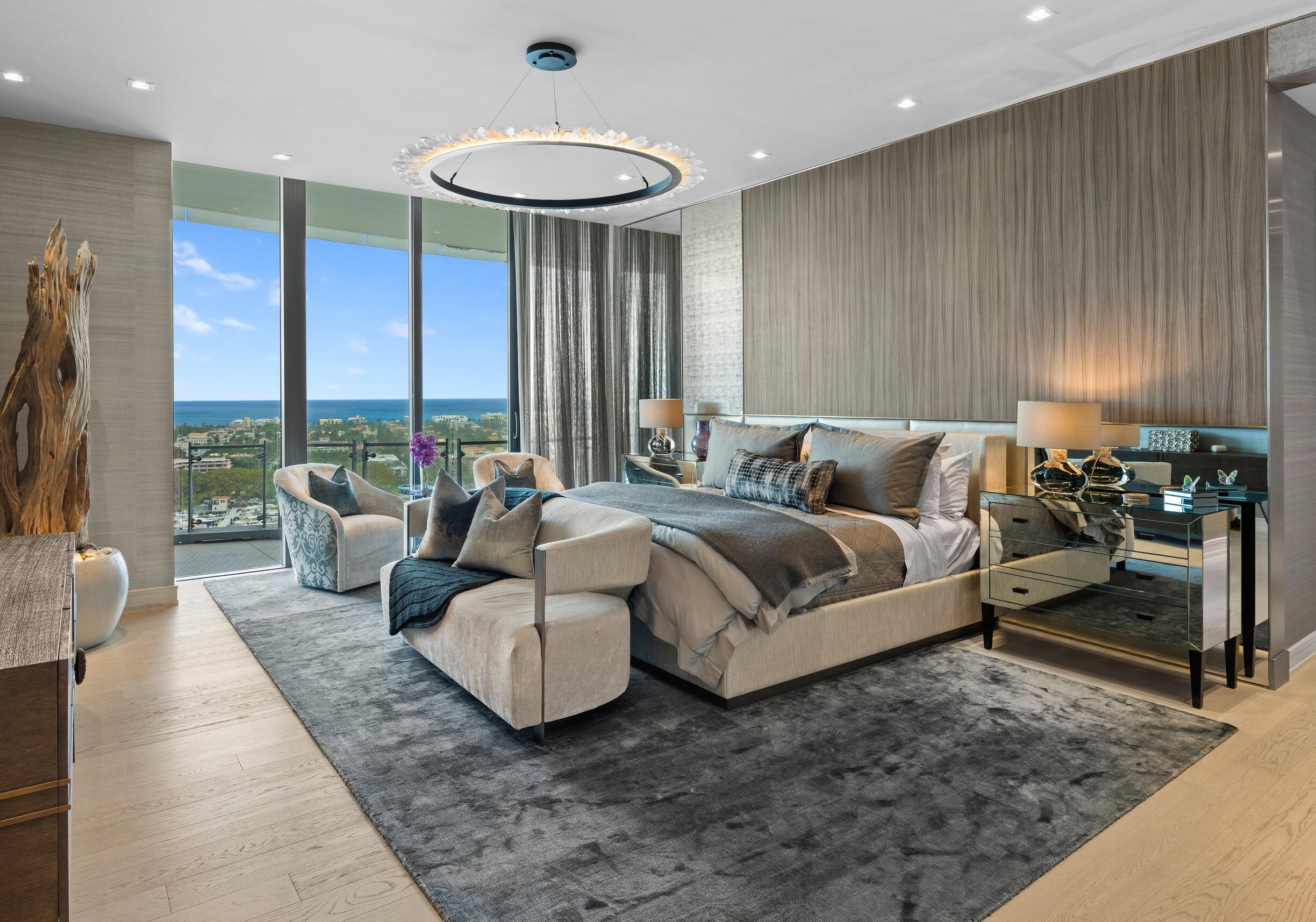 NOTHING ELSE COMPARES to this truly magnificent Marc Michaels designed masterpiece in the sky. THE ONLY TURNKEY RESIDENCE TO EVER BE OFFERED AT THE BRISTOL, Palm Beach's most iconic and exclusive highrise. Residence 1901 has the most sought-after floorplan in the building which is the perfect alternative to a single-family home featuring 5,544 interior SF plus a 1,500 wraparound terrace. With chic contemporary design and the finest materials, this 4-BR plus office/ 5.1-BA showcases the most impressive panoramic views of the Ocean, Intracoastal, Palm Beach, and sparkling city lights. This rare NE corner residence has 11-ft floor to ceiling glass surrounding the entire residence. A stunning one-of-a-kind entertaining bar is an exquisite work of art... positioned in front of the most amazing views in Palm Beach. A perfectly curated primary bedroom suite with dual bathrooms both with spectacular direct east water views, dolimiti marble, and Italian Fantini fixtures. Both of the spacious dressing rooms consist of custom closets built with the finest materials. A state-of-the art kitchen featuring top of the line Gaggenau appliances (gas stove, induction cooktop, 2 dishwashers, 2 ovens & more), Snaidero Italian cabinetry, and 100-bottle Sub Zero wine refrigerator. Additional highlights include immaculate built-ins, bespoke furnishings, an enhanced Crestron Smart Home technology (automated control of everything from lighting, shades, sheers, music, thermostat, and more).

The Bristol has succeeded in setting a new standard for ultra luxury living in Palm Beach and is renowned for its most impressive 5-star amenities and special attention to detail including on-site professional concierge, two spas, beauty salon, waterfront fitness center, 75-ft resort-style swimming pool, club lounge and dog park. Two house vehicles equipped with a driver, gated entrance, and 24-hour valet and front desk.
Residence includes an assigned parking spot. There is an option to purchase a private 3-car garage and a rare turnkey guest suite also designed and furnished by Marc Michaels.
