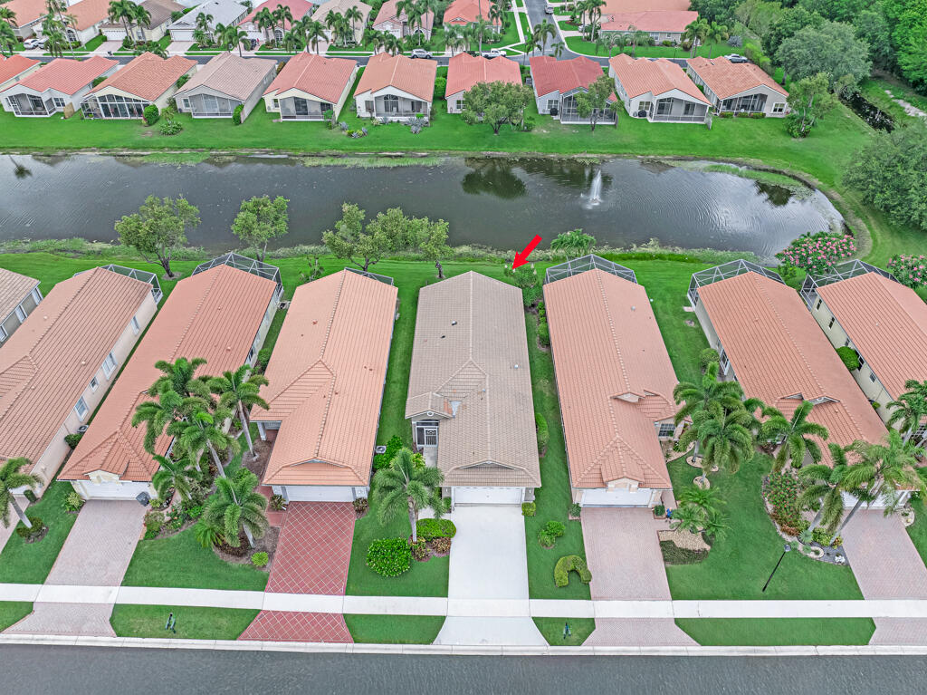 Great Opportunity! Beautiful waterview! Private and quiet street. Buy at a lower price and make it your own. This is the best buy in an active lifestyle community. Don't miss your chance. The Grove is an active-adult 55+ community with 501 homes, situated in southern Palm Beach County in Boynton Beach, Florida, one of Palm Beach County's most desirable areas. The Grove is located approximately seven (7) miles west of the Atlantic Ocean, between the cities of West Palm Beach to the north, Delray Beach and Boca Raton to the south. With nearby access to Florida's Turnpike and I-95, all of southeast Florida's wonderful attractions are within easy reach. The beautiful ocean beaches and the Intracoastal Waterway are literally just minutes away. Our 24-hour staffed, gated enclave features  features ten (10) lakes which grace the community's four neighborhoods, consisting of estate homes, manor homes and coach homes. A stately entrance drive, surrounded by beautiful palm trees, provides an attractive welcome and links a pedestrian-friendly walkway to each neighborhood. Swaying palms and native trees dot the community. Our friendly community has a beautiful clubhouse which is easily accessible from all areas of the development. The Grove Clubhouse features an Olympic-sized swimming pool, a sauna and a Jacuzzi. The pool is heated during winter months and cooled during the summer months. The pool deck features attractive and comfortable lounge chairs, tables and umbrellas. The clubhouse, with its exquisite atrium, features a beautiful multi-purpose ballroom for parties, shows and gatherings. A state-of-the-art fitness center includes the latest cardiovascular equipment, weights and treadmills. In addition, there are several card rooms, a billiards/pool room, an arts & crafts room and a library. Adjacent to the clubhouse are four (4) championship Har-Tru tennis courts, two (2) pickleball courts, a shuffleboard court, bocce court and putting green. Our full-time adminstrative/ social director provides us with fabulous entertainment, including informative and entertaining lecture series, all year long. The Grove offers something for everyone, including Men's & Women's Clubs, Tennis Club, Singles Club, Boomers Club, Hot Topics Club, Jewish Heritage Club, Performing Arts League, Snowbird Club, Bowling, PAP Corps and Hadassah, billiards, aerobics classes and many other activities. Located nearby are a variety of shopping centers containing a Super Target, Publix supermarkets, future Whole Foods, restaurants, Urgent Care, a hospital, future library and many other amenities. We look forward to welcoming you to our lovely community. Come visit us and see what we're all about! The Grove can be reached by car by taking I-95 to the Boynton Beach Boulevard exit, traveling west for about five miles. The Grove is on the right-hand side of Boynton Beach Boulevard, just before Florida's Turnpike, approximately 1/4 mile west of Hagen Ranch Road. The Grove is also accessible from Florida's Turnpike at the Boynton Beach Boulevard exit (No. 86). ,