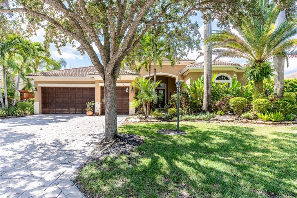 Don't miss the opportunity to grab this beautiful home in the desirable community of Fox Ridge!  Outstanding upgrades and features include: open & airy floorplan; volume ceilings; beautiful kitchen (open to the family room) w/wood cabinets, granite countertops, stainless steel appliances, double ovens, etc; breakfast area with built-in seating; large family room with built-in wall unit; split bedroom plan with 5 true bedrooms; updated spa-like master bathroom w/dual sinks, free-standing tub, large shower & Toto toilet; custom closets; French doors leading to the pool/patio; oversized covered patio & screen-enclosed pool; tropical landscaping with fruit trees (mango, avocado) and more! Community offers tennis courts, volleyball, playground, walking paths, etc.  Walk to all A-rated schools!