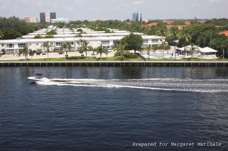 Prestigious Bay Colony Club on the Intracoastal! Remodeled spacious 1 bedroom features kitchen with wood cabinets-customized lighting, granite counters & stainless appliances.  Primary suite with several closets, crown moldings, tile floors & large impact window. Remodeled primary bath/rain shower, seamless shower door & floating vanity. Extra remodeled powder room for guests! Tile floors throughout, newer AC 11/2023, newer hot water tank with safety facuet. Spacious screened/tiled patio with Impact sliding door & large storage closet. Unique gated community features 4 heated pools, 3 club houses, 2 state of the art gyms, BBq's, billard rooms, library & conference room. Tennis/Pickle Ball courts + Additional Gazebo Bar on the Intracoastal for relaxed dining! Community also has boat dockage for $2.00 per linear foot with no fixed bridges seconds to the Intracoastal! Don't pass this one by!