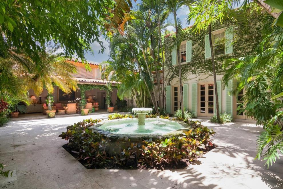 Exceptional and very special Palm Beach residence is on 3 in-town parcels. a 1925 era home built for the quintessential outdoor, indoor lifestyle & enhanced by John Volk in the 1960s & completely restored by Livingston Builders in 2000. Charming covered loggias, pecky cypress detailing, 1500 bottle wine storage, pub, 4BR/3BA guest wing, whole house generator, 5-zone AC, 2-car garage