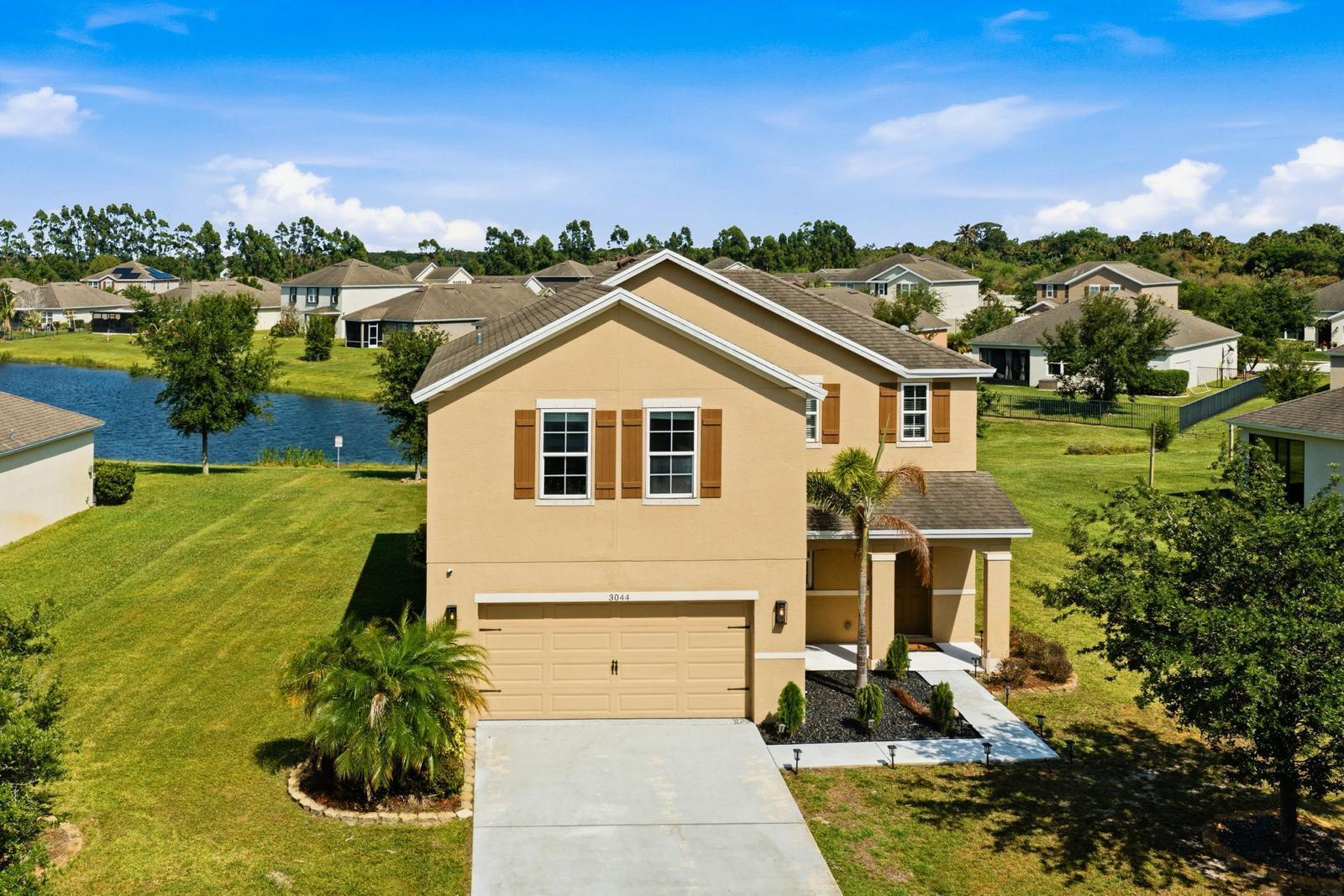 Welcome to your dream lakefront retreat in Fort Pierce! This beautifully upgraded 3-bedroom, 2.5-bath home offers the perfect combination of modern comfort, stunning water views, and exceptional outdoor living.  From the moment you enter, you'll love the bright open-concept layout designed for both everyday living and entertaining. The chef-inspired kitchen features granite countertops, ample cabinetry, and seamless flow into the spacious living and dining areas. Tile flooring throughout the main living spaces adds both style and easy maintenance.  The spacious owner's suite is a true sanctuary, featuring a large custom walk-in closet and a private en-suite bath. A versatile flex room provides endless possibilities as a home office, media room, gym, nursery, or potential fourth bedroom. Step outside and discover what truly sets this property apart. Enjoy breathtaking lake views from your private backyard oasis complete with a pergola, cozy fire pit area, and plenty of space for relaxing, entertaining, and creating unforgettable memories.  Additional highlights include a Tesla charging station in the garage, ample storage, and pride of ownership throughout. Ideally located just minutes from I-95 and Florida's Turnpike, you'll enjoy easy access to shopping, dining, beaches, and everything the Treasure Coast has to offer.  Lakefront homes with this combination of upgrades, outdoor amenities, and convenient location don't come along often—schedule your private showing today!