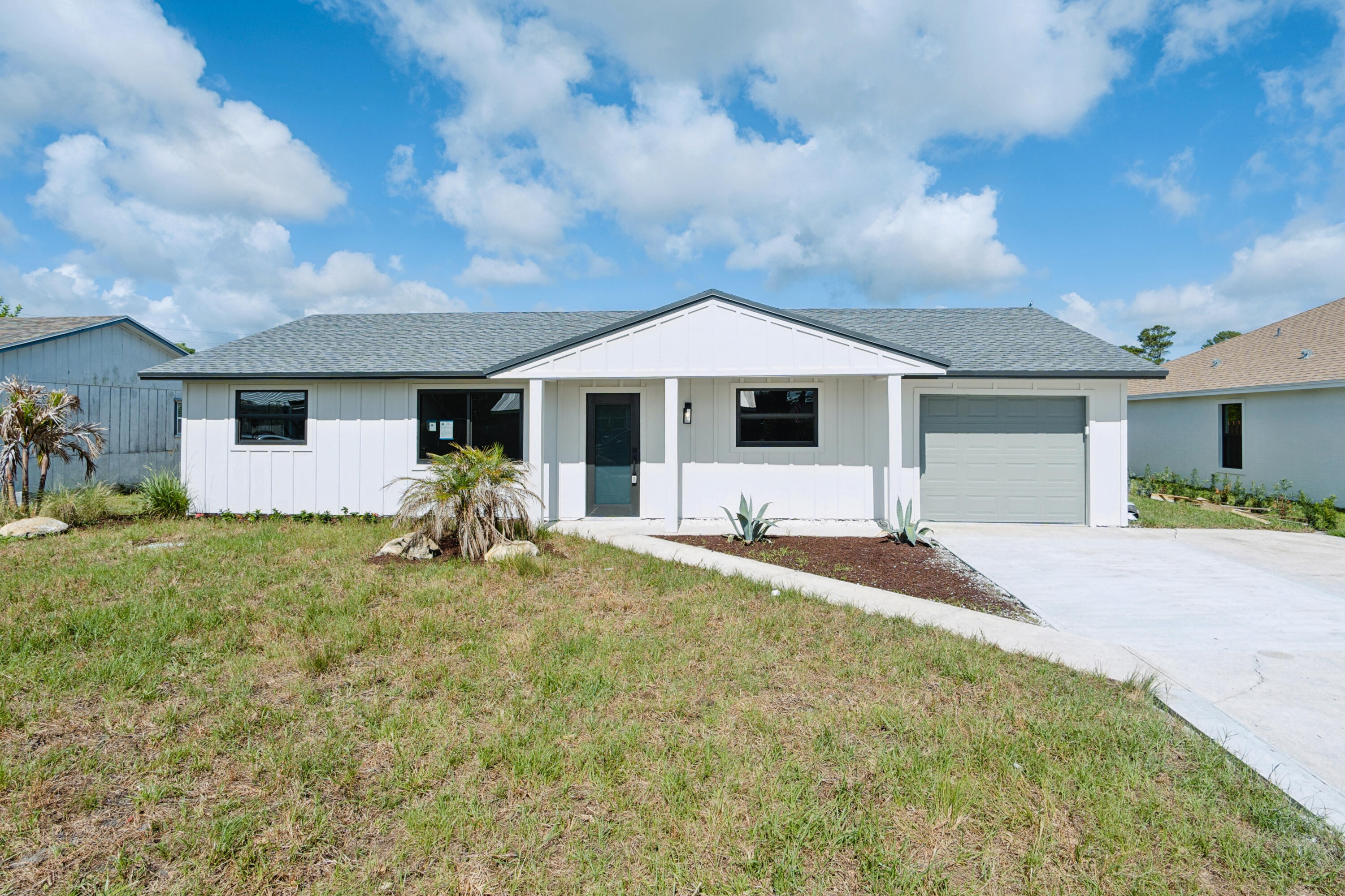 Thoughtfully updated and move-in ready, this 3-bedroom, 2-bath home is tucked within a quiet Port Salerno neighborhood surrounded by Sea Branch Preserve. Enjoy an outdoor-focused coastal lifestyle just minutes from boat ramps, marinas, waterfront dining, shopping, and only a short drive to Hobe Sound Beach. The home features an updated kitchen with new stainless-steel appliances, refreshed bathrooms with new flooring, tile, vanities, toilets, and lighting, plus a spacious fenced backyard & attached one-care garage. Major improvements completed in 2026 include a new roof, impact windows and doors, and a new AC system, provide peace of mind.