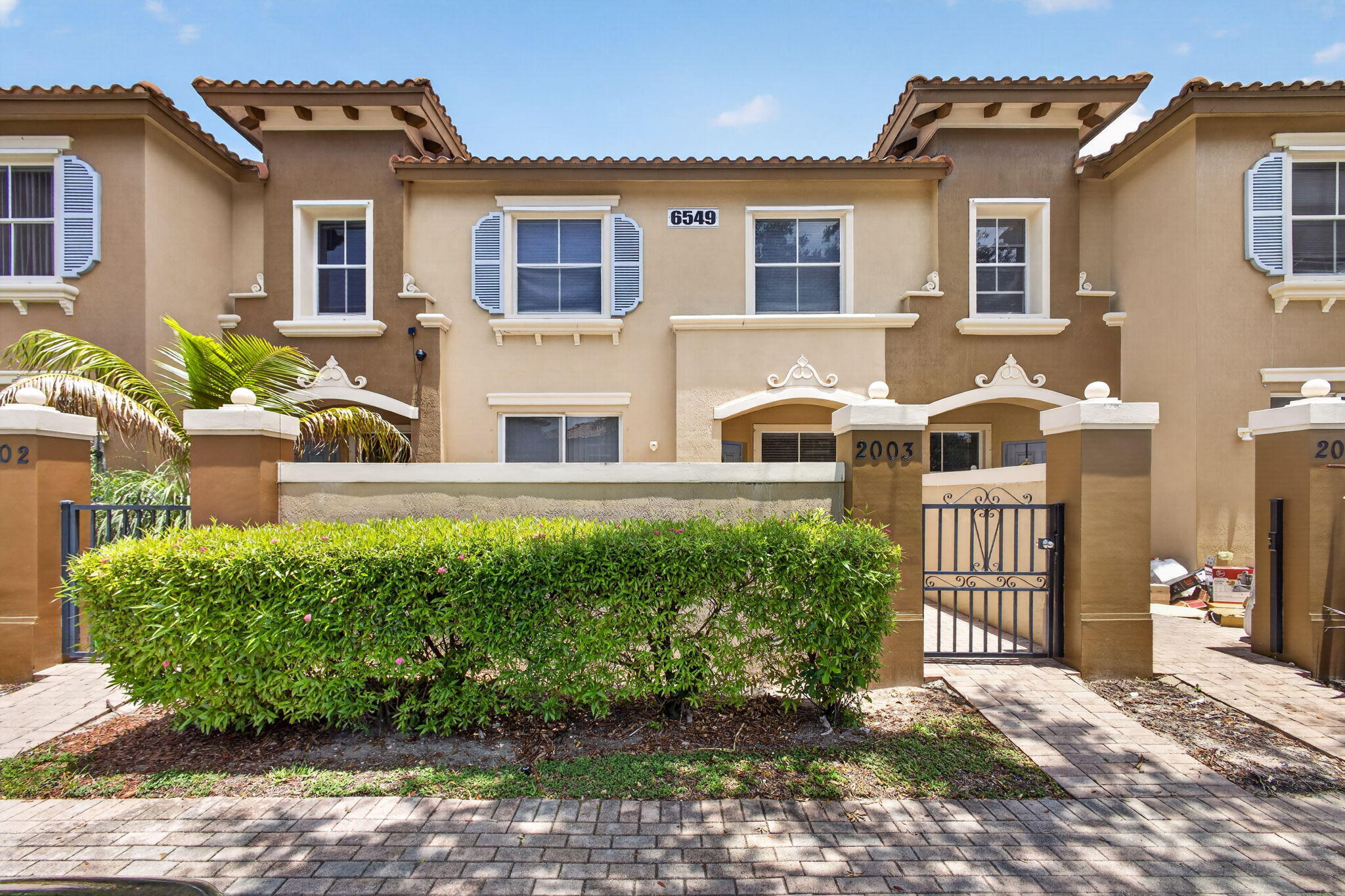 This is a beautifully maintained 2-bedroom, 2.5-bath townhouse located in a desirable gated community. Freshly painted and featuring brand-new carpeting upstairs, this move-in-ready home offers a bright and comfortable living space with durable tile flooring throughout the main living areas. Enjoy outdoor living with private patio and the convenience of assigned parking. The community amenities include a sparkling pool and playground, both within easy walking distance, making this a great option for families, first-time buyers, or investors. HOA requires a minimum 600 credit score. With a low HOA fee and the ability to rent immediately, this property offers exceptional flexibility and value. Conveniently located near the Florida Turnpike, major shopping centers, restaurants,