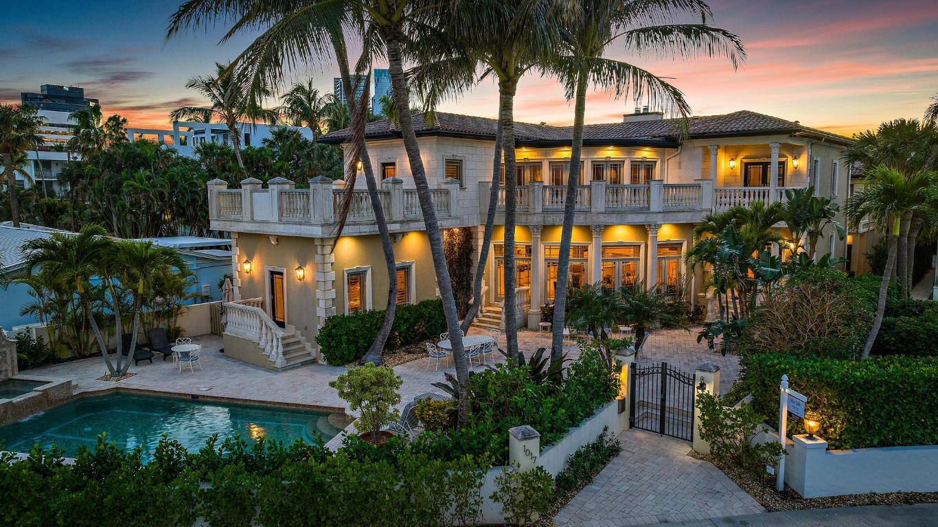 Waterfront Mediterranean home with fabulous water views of Palm Beach Island. This is a prime location near the new NORA entertainment district in West Palm Beach. This spectacular 6 bedroom, 6.1 bath residence and guest house has a spacious open plan, a luxury kitchen with a 6-burner gas stove, wine room, bar area with wine refrigeration & ice maker, dining area with fireplace, two offices/dens, & a full laundry room. The water-view Primary bedroom has a fireplace & two baths. With a luxurious pool area, several patios, & balconies the house provides an indoor/outdoor lifestyle. Includes a 1-bedroom, 1-bath guest house with a full kitchen & 2-car garage. A spectacular location across from the Palm Beach Yacht Club and close to NORAwpb, fine dining, luxury shops, marinas, & bike​​‌​​​​‌​‌​​​‌‌​​​‌‌‌​​‌​​‌‌​​​​ path.