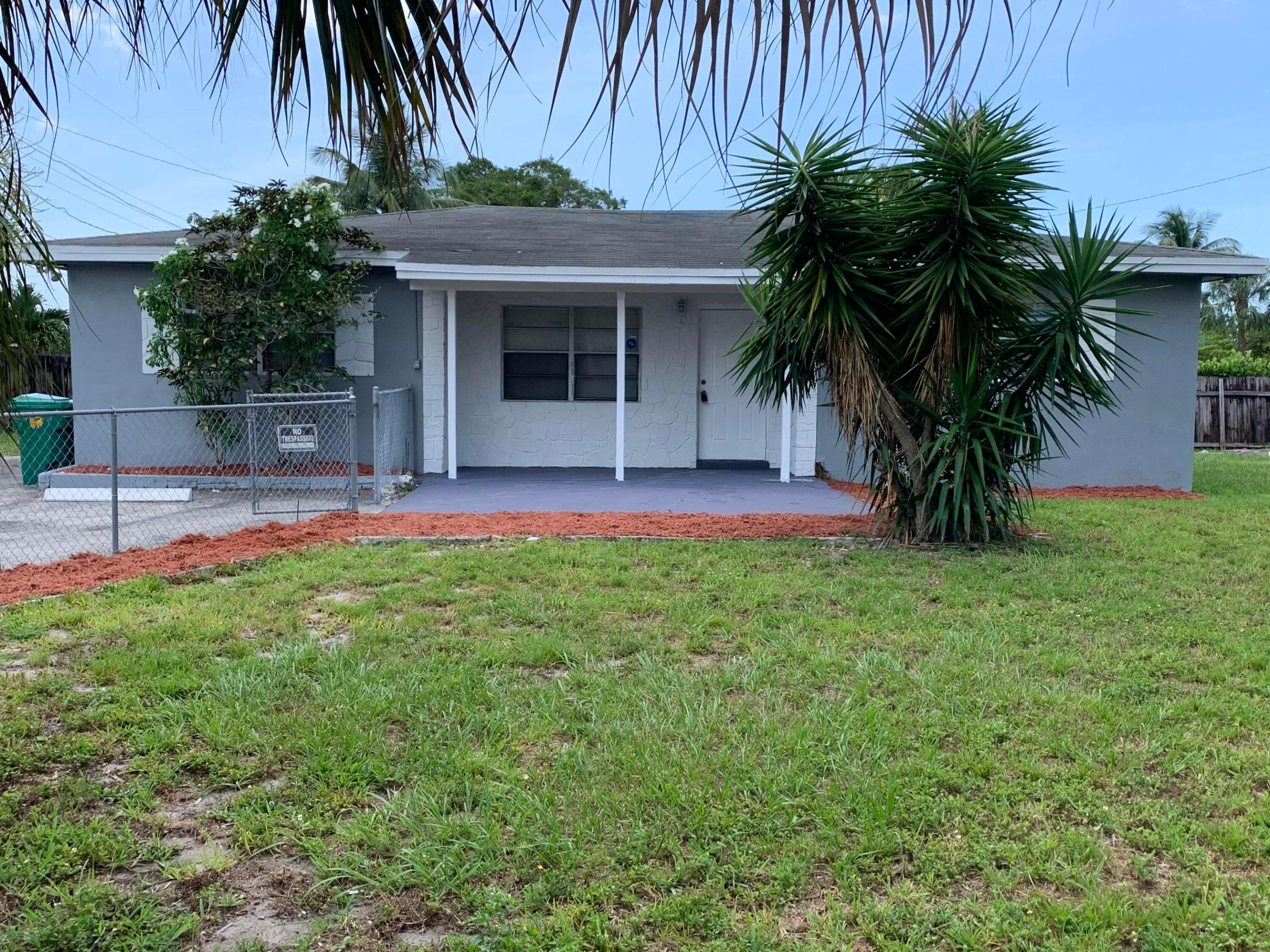 Location! Location! Location! Nice 3 Bedroom 2 Bathroom single family home on a fenced corner lot. No HOA,  One of the home's most desirable features is its massive corner lot, providing a spacious garden oasis with room for a pool, outdoor kitchen, children's play area RV/boat parking or future expansion. Close the new Publix Supermarket & Shopping Plaza, Close to Transportation, being conveniently located near to 441/State Rd 7. Tile, new Laminate flooring & paint gives the house a nice clean look & feel. Walk in & you will love this home. Take a look & make an offer..... Won't last! Easy to show - Schedule on ShowingTime. Washer & Dryer reported to work but is not included in the appliance list. Buyer to keep.