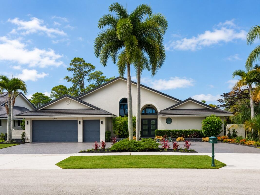Beautifully renovated from top to bottom 3-bedroom, 3-bath estate home offering approximately 2,600 sq. ft. in Boca Woods Country Club. Enjoy breathtaking lake and golf course views stretching from the 17th tee all the way to the clubhouse from your private pool and expansive patio.  This move-in-ready residence features soaring vaulted ceilings, polished porcelain tile throughout, upgraded interior doors, abundant natural light, and an open-concept floor plan designed for comfortable living and entertaining. The luxurious master suite offers 2 walk-in closets, linen closet and a spa-inspired bath featuring a Jacuzzi tub, oversized shower, dual vanities, and bidet. The 2nd bedroom includes its own en-suite bathroom and walk-in closet,  while the 3rd full bath features a skylight and large glass-enclosed shower. All closets are equipped with custom built-ins.  The designer kitchen has been fully renovated with quartz countertops, a dramatic waterfall island, glass tile backsplash, stainless-steel appliances and abundant storage. The updated laundry room complements the kitchen with matching cabinetry, countertops and backsplash.  Wall-to-wall sliding glass doors create seamless indoor/outdoor living, opening to a spacious covered patio with soaring vaulted ceiling, outdoor shower, private pool, panoramic golf & lake views.   Highlights include golf cart garage, circular driveway, 2020 roof, 2019 A/Cs (2), 2025 water heater, NEST digital thermostats, Ring Doorbell & FPL EV charger.  Golf cart included. Furniture negotiable. $150,000 mandatory initiation fee.  Enjoy 36 holes of golf, newly renovated clubhouse, tennis, pickleball & state-of-the-art fitness center in a 640 home-gated community