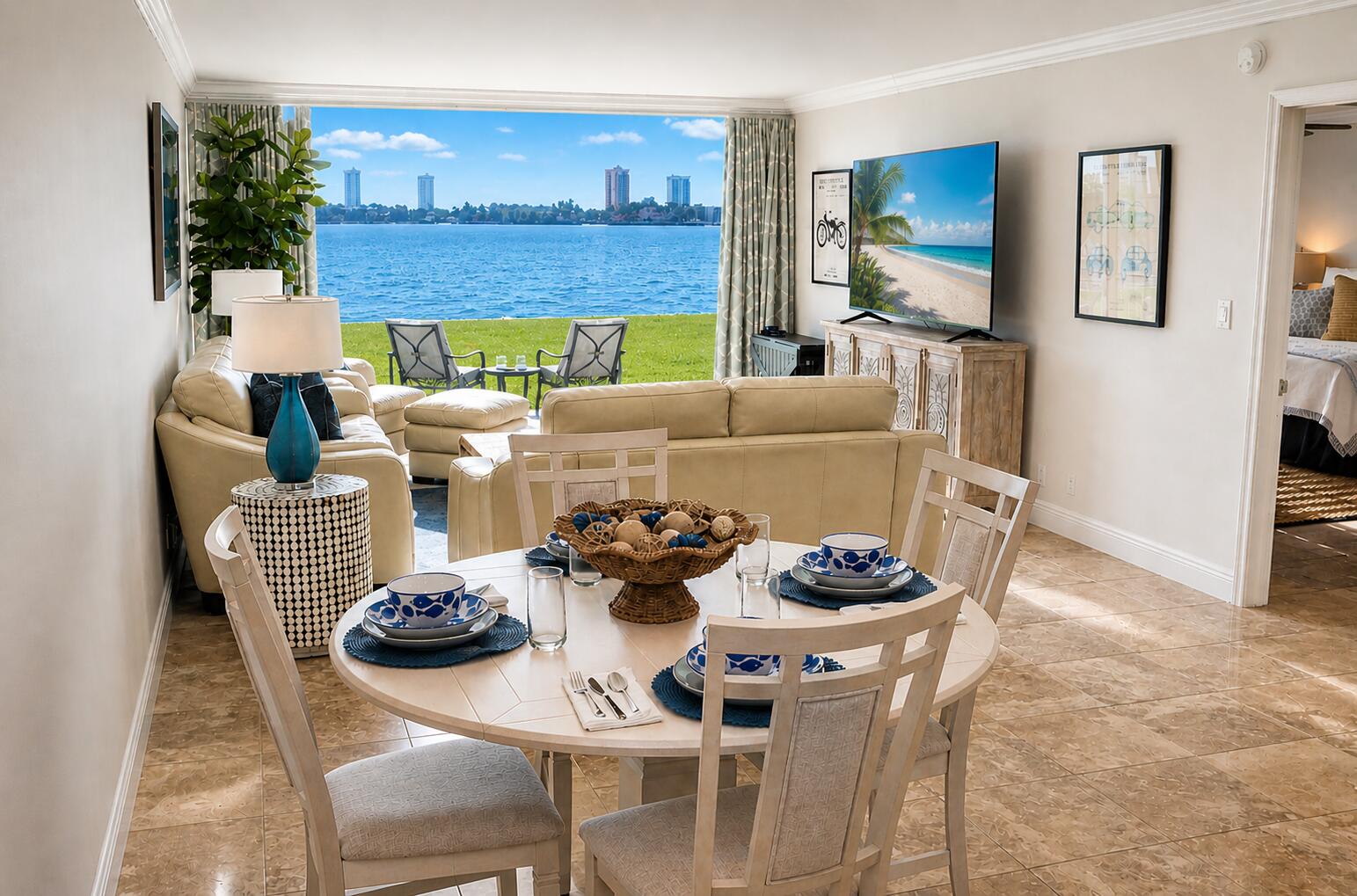 Experience true waterfront living on the Intracoastal! This rare 2BR/2BA ground-floor condo is one of only seven walkout units, featuring a private outdoor patio overlooking the water and a lush grass lawn just steps away. Enjoy breathtaking sunrises over Singer Island as boats and jet skis glide by, with frequent sightings of manatees, turtles, and stingrays. Beautifully furnished in a fresh coastal style, this home offers stainless steel appliances, tile floors, stackable washer/dryer, auto blinds, and a walk-in tub in the guest bath. King bed in the primary, queen in the guest, plus generous closet space. Community pool, walk to Lake Park Marina, and just 5 minutes to beaches, dining, shopping, snorkeling, and Peanut Island. South Florida living at its best! NOTE: Community Amenities Photo includes virtual enhancement for illustrative purposes.