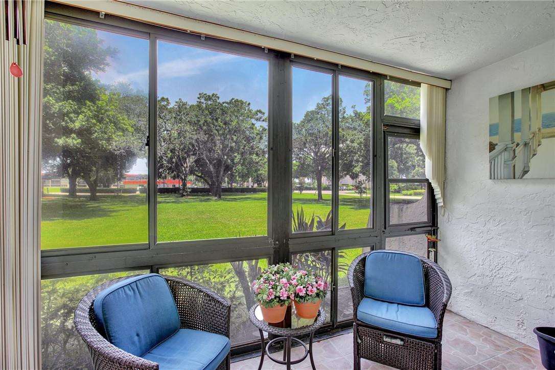 Full Two Bedroom On Par 3 Golf Course With Garden View-Patio Has Been Enclosed For Extra Living Space-Upgraded White Kitchen With Granite Counters and Breakfast Bar For Open  Concept-All Tiled Flooring-Bathrooms Have Upgrades-Parking In Front Of Condo-Walk To Pool And All Amenities-Furniture Is Negotiable-Owners Have Total Appliance Package Which Can Be Prorated At Closing-May Have One Pet to 20 Lbs With Vet Letter-Clean and Shows Well-Paid up rec lease. Free golf, 14 tennis courts, 7 pools, theater, fitness center, restaurant, 24 hr security, Assoc. represents housing for older persons authorized (HOPA)..   *** IMPORTANT! See Broker Remarks below for occupancy qualifications. Free golf, 24-hour security, tennis, restaurant, bus, theatre, fitness center, and more