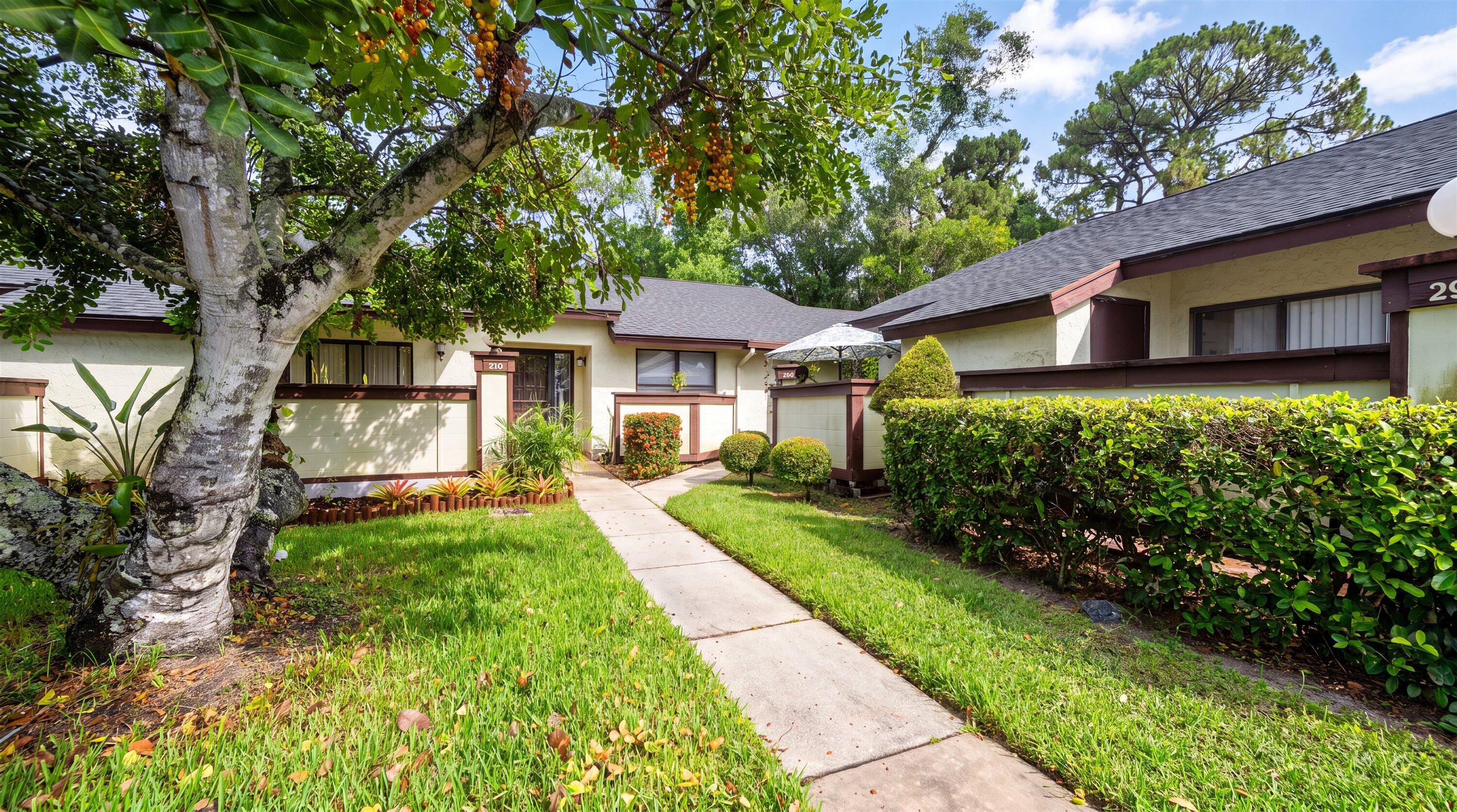 Welcome to this charming 2-bedroom, 2-bathroom villa situated in Strathmore Gate West Unit 1 in Royal Palm Beach, Florida. This single-story residence offers 1,120 square feet of well-appointed living space, providing an efficient and comfortable layout. The villa format delivers a distinctive residential experience within this established community. Whether you're seeking a streamlined living situation or a solid investment property, this home presents an attractive opportunity in a convenient Royal Palm Beach location. This incredible villa has been beautifully renovated with exceptional taste and quality materials throughout. Offering a spacious layout with 2 bedrooms, 2 bathrooms, and a large enclosed porch with A/C, this home provides additional flexible space perfect for accommodating guests or creating a cozy sitting area.  Enjoy tile flooring throughout the main living areas, with warm wood laminate flooring in the bedrooms. As you approach the front entrance, you are welcomed by a charming open patio complete with an umbrella and inviting surroundings — the perfect place to relax and enjoy your morning coffee.  Inside, you'll immediately appreciate the bright, clean, and open-concept design that truly feels like home. The spacious kitchen features attractive cabinetry and includes a separate laundry room with a full-size washer and dryer for added convenience.  Both bathrooms have been tastefully renovated and offer comfort and functionality for everyday living. For the buyer's convenience, the owner is offering the property furnished with tasteful furnishings that are in excellent condition.  This is a wonderful opportunity you do not want to miss. Once you see this beautiful villa, you'll want to make it your own. Schedule your private showing today!