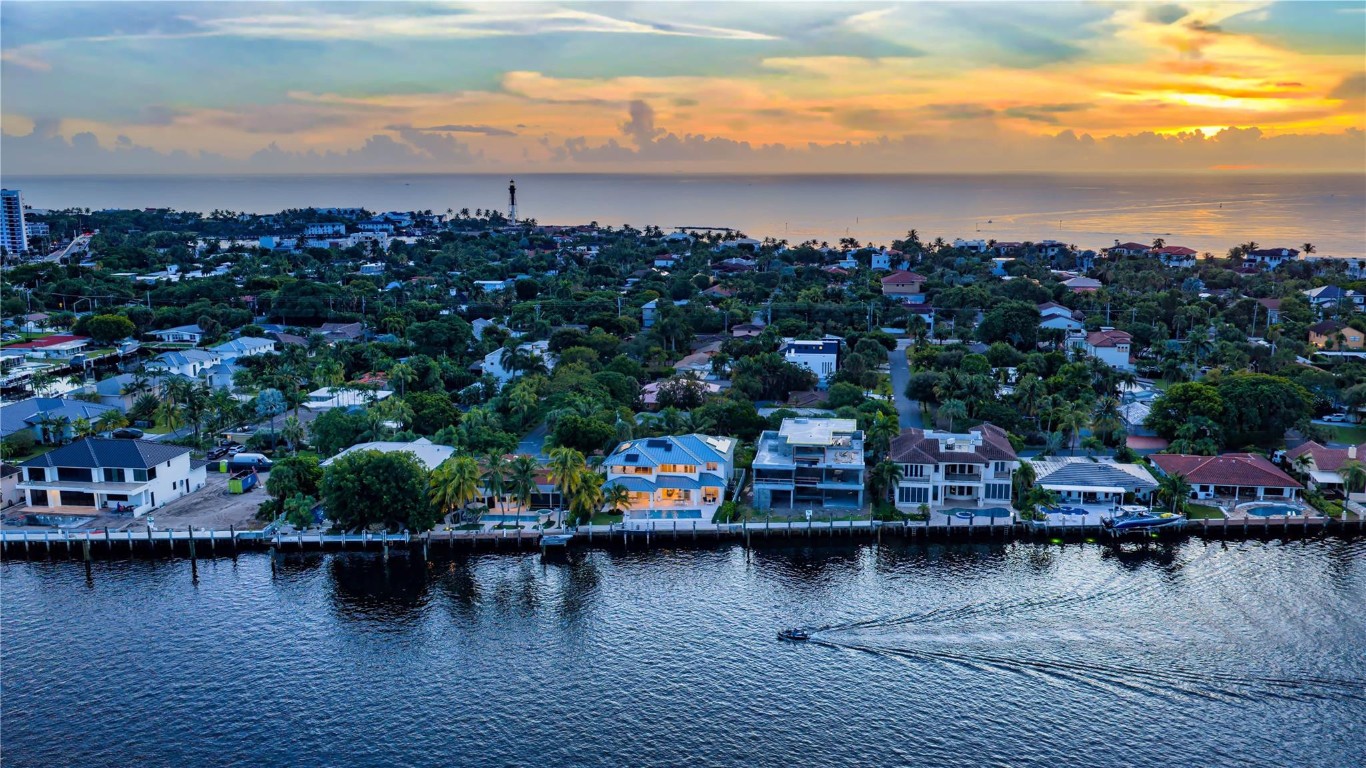 Coastal-Inspired Intracoastal Estate artfully crafted by Garza Contractors in the exclusive enclave of Hillsboro Shores with private beach access and fronting 77'+/- on the wide intracoastal waterway. Excellent opportunity to enjoy the very best in beachside luxury life-style offered in South Florida. Light-filled coastal interiors reveal five-bedrooms, five-bathrooms and one-half bath with 5,741+/- Total SqFt. Custom designer kitchen with quartz countertops, and luxe Thermador appliances. Second level primary suite with sitting area and spacious primary bathroom featuring an expansive walk-in wet room. For boating enthusiasts, this spectacular estate features a 67'+/- concrete dock in a no-wake zone just minutes to the Hillsboro Inlet. Shown By Appointment Only. DISCLAIMER: Information published or otherwise provided by the listing company and its representatives including but not limited to prices, measurements, square footages, lot sizes, calculations, statistics, and videos are deemed reliable but are not guaranteed and are subject to errors, omissions or changes without notice. All such information should be independently verified by any prospective purchaser or seller. Parties should perform their own due diligence to verify such information prior to a sale or listing. Listing company expressly disclaims any warranty or representation regarding such information. Prices published are either list price, sold price, and/or last asking price. The listing company participates in the Multiple Listing Service and IDX. The properties published as listed and sold are not necessarily exclusive to listing company and may be listed or have sold with other members of the Multiple Listing Service. Transactions where listing company represented both buyers and sellers are calculated as two sales. “No payments made until title passes” Some affiliations may not be applicable to certain geographic areas. If your property is currently listed with another broker, please disregard any solicitation for services. Information published or otherwise provided by seller, listing company or its representatives is deemed reliable but are not guaranteed and subject to errors, omissions, or changes without notice. Copyright 2026 by the listing company. All Rights Reserved.
