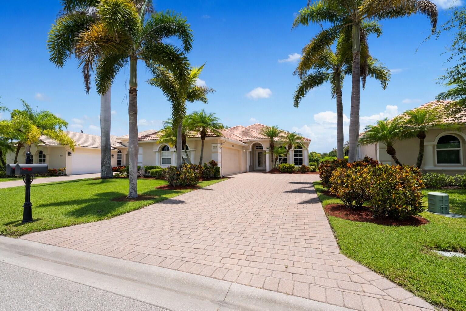 Nestled within the gated community of Jensen Beach Country Club, this beautifully maintained residence blends timeless comfort with effortless Florida living. The open-concept design features a well-appointed kitchen with granite countertops, stainless steel appliances, a breakfast bar, dining nook, and wine cooler. A spacious screened lanai overlooks a large backyard with peaceful golf course views and exceptional privacy.  Surrounded by lakes, nature preserves, and lush fairways, residents enjoy guarded gate access, resort-style pools, tennis and pickleball courts, a clubhouse, and optional golf memberships. Ideally located just minutes from beaches, marinas, parks, shopping, dining, and top-rated schools, this home offers the very best of the Treasure Coast lifestyle.