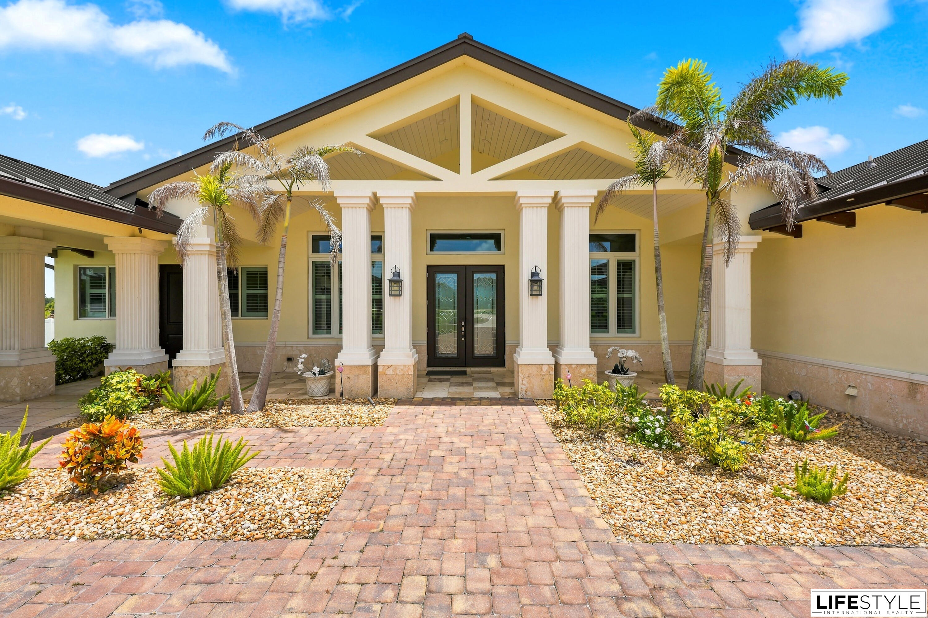 Beautifully maintained custom built home on 5 sprawling acres in an equestrian friendly community. Built in 2021, this 4 bedroom, 4 bath ranch style residence sits under a durable metal roof. Vaulted ceilings and a split floor plan lead into a chef's kitchen with a large island, gas range, and oversized refrigerator. Formal dining room, den, and great room offer flexible living space. Primary suite includes a whirlpool tub, dual sinks, and separate walk-in shower.    Recent upgrade includes a brand new AC system installed in 2026. Also featuring impact windows and a whole house generator. Outside, enjoy a covered porch and deck overlooking the pool and summer kitchen, plus a vinyl fenced yard and open acreage ideal for horses.