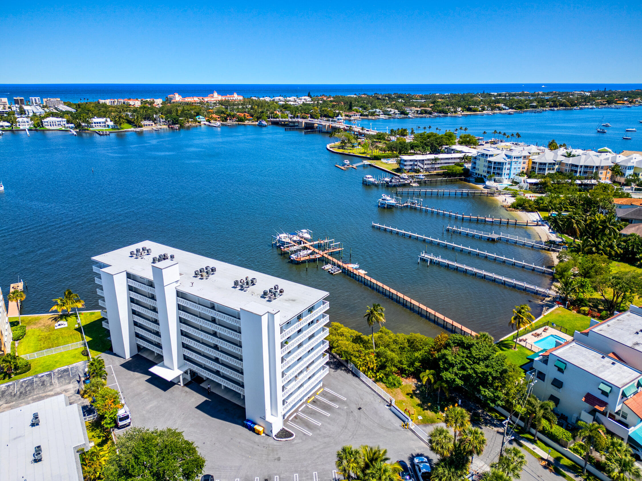 COASTAL LIVING with Peace of Mind! Welcome to your perfect coastal retreat, featuring direct water views of the Intracoastal from both living room and primary bedroom. This spacious 2-bedroom, 2 bathroom condo offers two en-suite bathrooms, providing privacy and comfort for the ideal escape. The beautiful white kitchen features newer appliances, perfect for cooking and entertaining. New A/C and hot water heater installed in 2024. Enjoy added security and energy efficiency with hurricane windows and doors throughout the unit. The building has completed its Milestone inspection. There is a heated, salt water pool over looking the Intracoastal, perfect for relaxing and soaking in the beautiful surroundings. Ideally located just a short walk to downtown Lantana's popular restaurants and shops and only a quick drive or bike to the beach. Watch the spectacular fireworks from your balcony while you sip a glass of wine. This location offers the ultimate in convenience and coastal charm. Don't miss this incredible opportunity to experience the waterfront lifestyle you've been dreaming of.