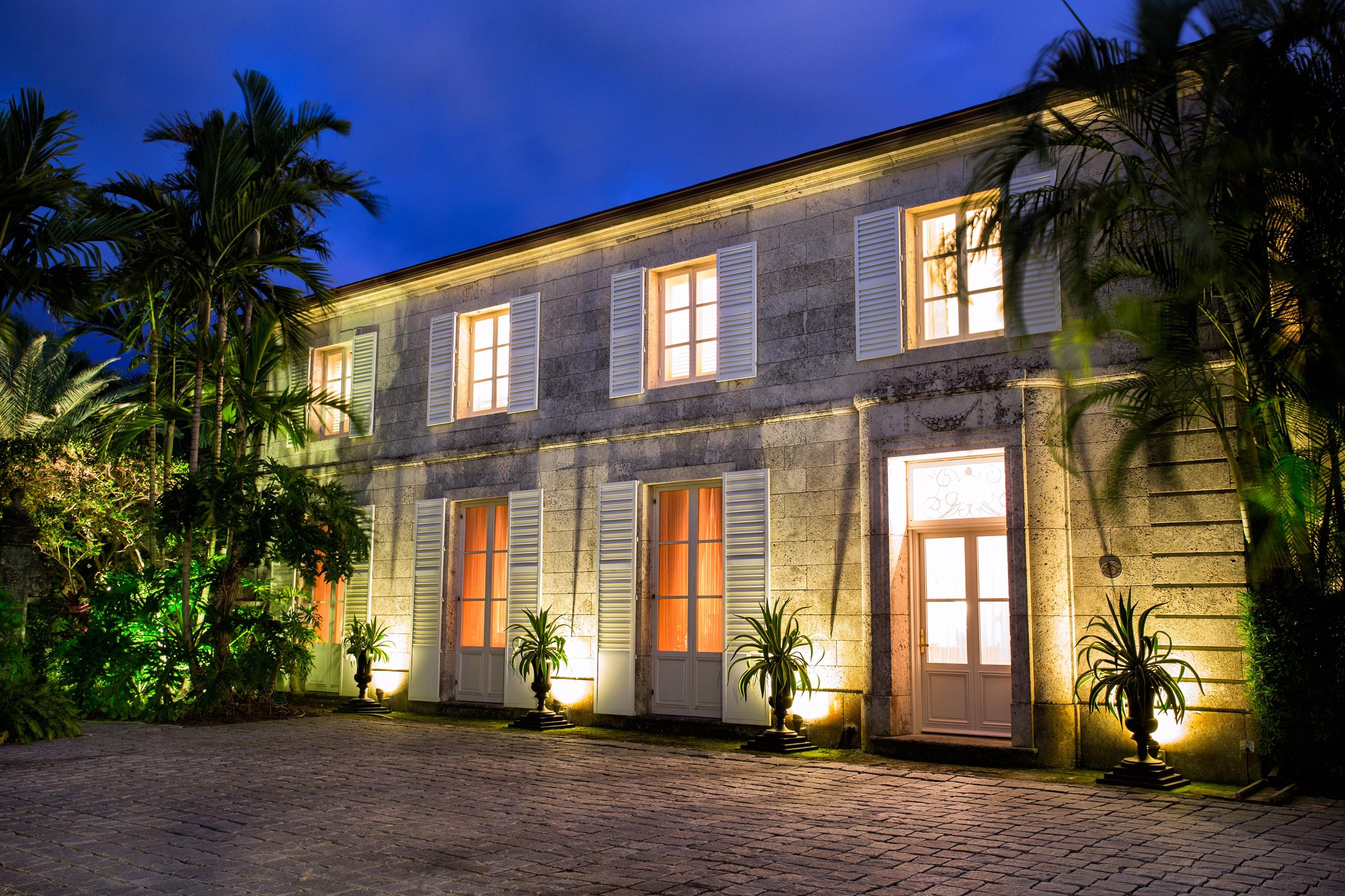 Extraordinary, Landmarked, late 1920’s Palm Beach estate created by Howard Major in a “Creole” French Classical design. The stately residence, sitting on a lot of approx. 25,200 sq. ft., is finished with natural rusticated quarried coral blocks originating from Cuba both on the entire exterior as well as several important living areas and trim work on both levels inside the home. Black, white and grey Carrera Marble floors seen throughout the home are believed to have come to the New World as ballast in sailing vessels later cut into floor tiles and installed in a convent in Cuba from whence it was recovered and used in few residences in Palm Beach.
The formal living room was designed especially to accommodate the beautiful walnut paneling recovered from a 17th century French Chateaux. Many more details make this home one of a kind and the favorite of many important architect's and historical enthusiasts.
With 10,501 Sq. Ft. of indoor and outdoor living, the home offers 6 bedrooms, 3 staff bedrooms, 8 full baths and 2 half baths, elevator, chefs kitchen, butlers pantry, 2 car garage, full house generator (60KW), Pool House with caterers kitchen, fully tiled 25x45 pool, private well for irrigation all surrounded by magnificent tropical gardens.