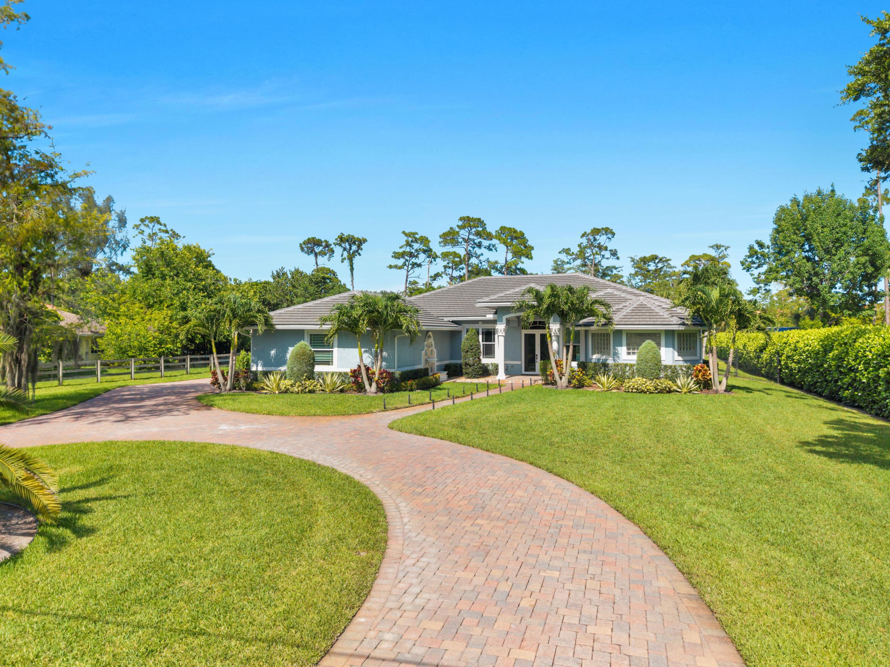Beautifully updated 4-bedroom, 3-bath home situated on 1 acre in desirable Pine Tree Estates in Parkland. This move-in ready property features a 2023 roof, 2023 impact windows and sliders, brand-new kitchen appliances, 2021 A/C units, an oversized 3-car garage, and a chef's kitchen with a walk-in pantry.  Additional upgrades include new well and sprinkler pumps, a fully fenced backyard, paver patio, and a lush privacy clusia hedges across the rear of the property. A rare opportunity to enjoy space, privacy, and major upgrades in one of Parkland's most sought-after communities no HOA and A+ rated schools!