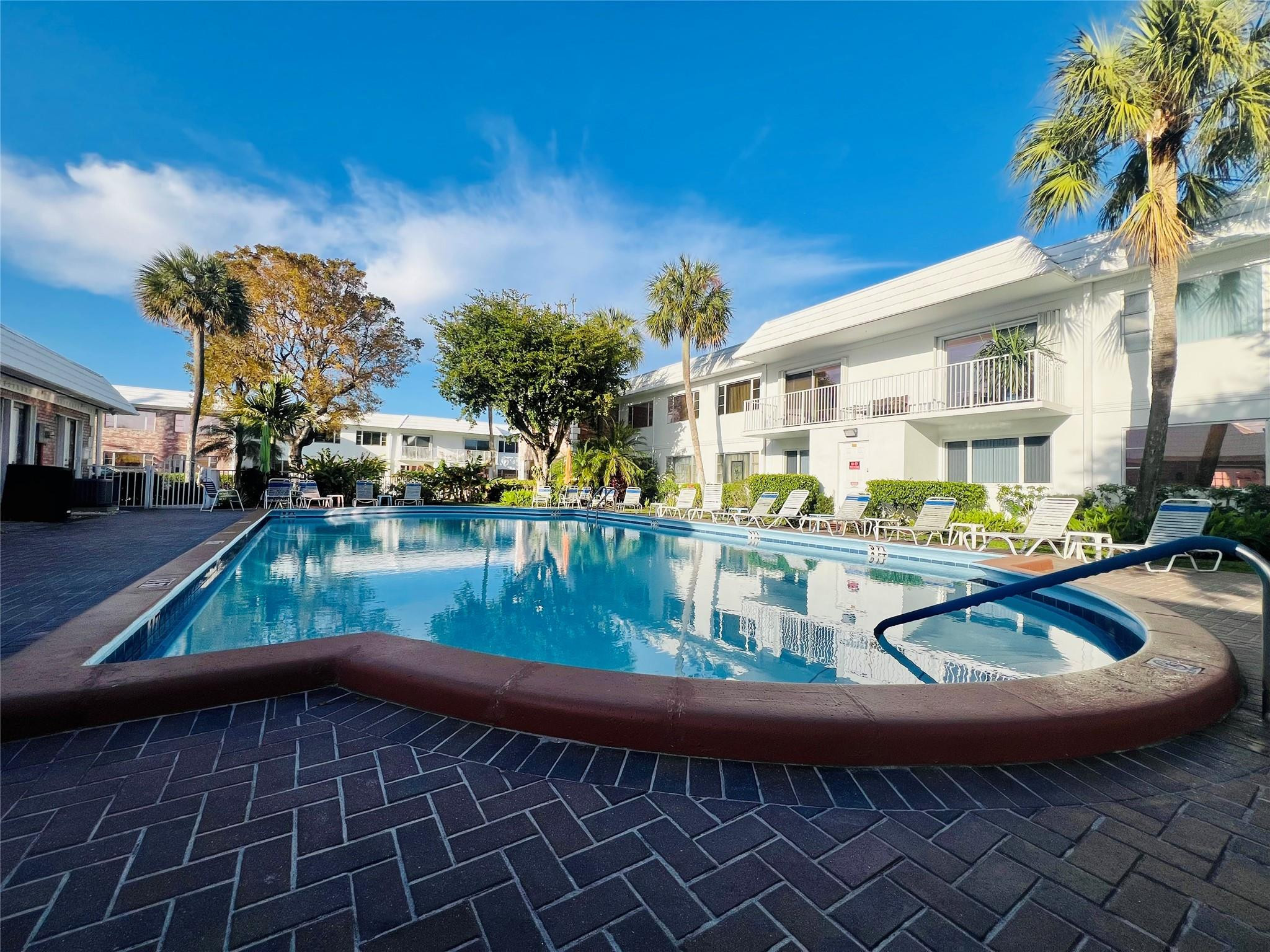 Welcome to your tranquil coastal retreat at The Virginian in Pompano Beach — where relaxed  living meets everyday convenience. This spacious one-bedroom, one-and-a-half-bath residence is filled with natural sunlight, creating an airy ambiance that feels instantly welcoming and peaceful. Enjoy one of the largest private balconies in Pompano Beach, offering the perfect setting for morning coffee, and quiet evenings under the coastal sky. The layout provides exceptional space and comfort, ideal for those who appreciate room to relax and entertain without sacrificing simplicity. Residents of this charming 55+ community enjoy a sparkling saltwater pool, beautifully maintained grounds, and a location that truly cannot be beat!