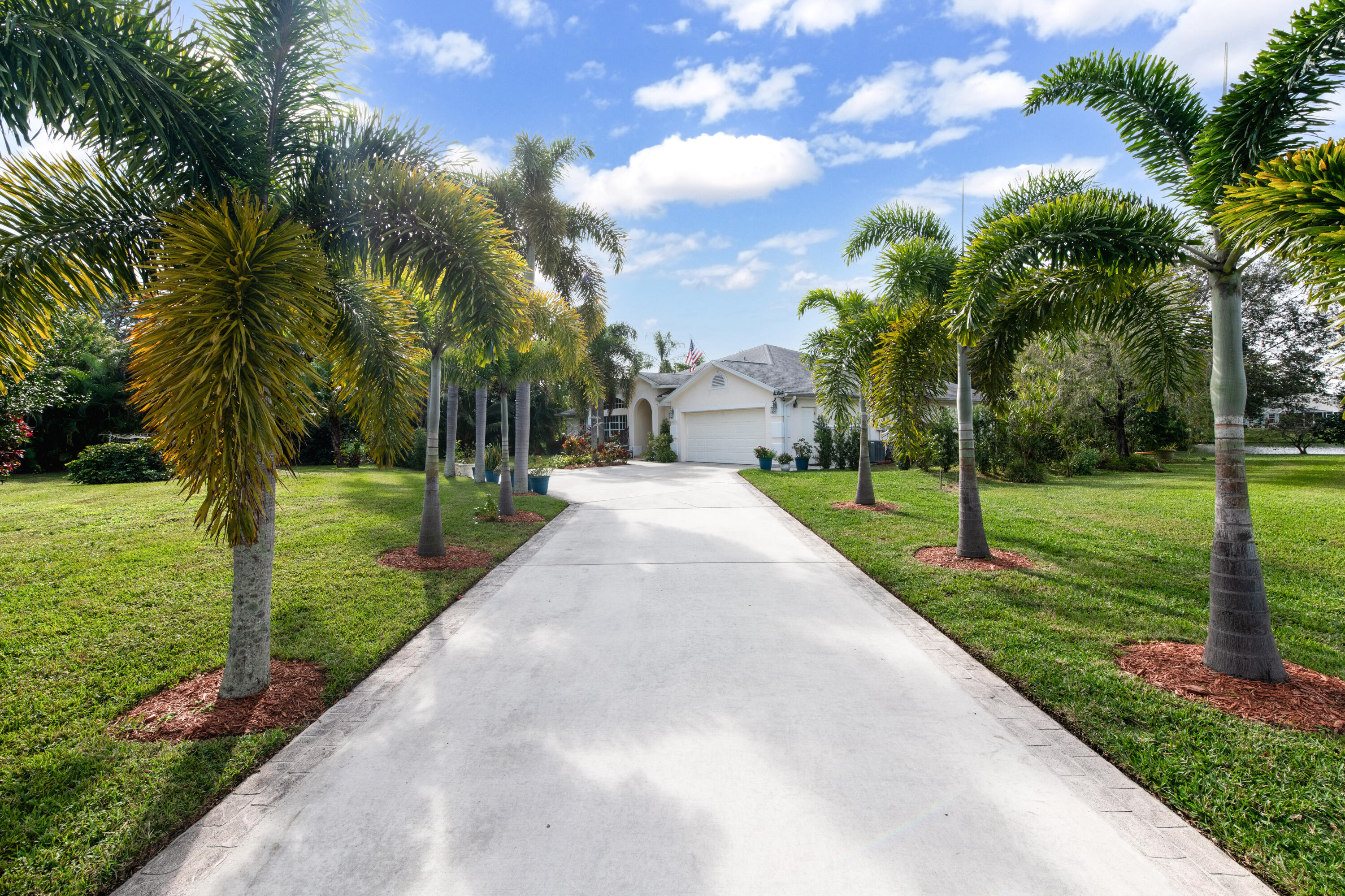 Welcome to our desirable, well-established Oleander Pines community! This is the home you've been waiting for! Breathtaking lakefront view from nearly every room, with .282 oversized corned lot. This home features BRAND NEW ROOF (5/25), BRAND NEW A/C and HEATING SYSTEM (11/24), BRAND NEW RHEEM WATER HEAT UNIT (11/24). This CONCRETE BLOCK HOME has a beautiful porcelain tiles throughout the home, with a beautiful NEW KITCHEN with soft close doors & 36'' cabinets, 10+ ft. quartzite countertop island, stainless steel appliances (2024) with spacious open concept design perfect for gathering. The property is very private and surrounded by conservation land. The primary suite is HUGE with two very large walk-in closet and conveniently open to your private backyard oasis, with vaulted ceiling The extended driveway surrounded by espectacular matured palm trees, with added bonus 5+ parking area ready for a new owner. This lot offering rare privacy and serenity, Once you see it, you'll fall in love with your very own private oasis!. Minutes from the beach, shopping centers, restaurants, NO CDD FEES, LOW HOA, PAY COUNTY TAXES ONLY... DON'T MISS OUT! and make a appointment today!