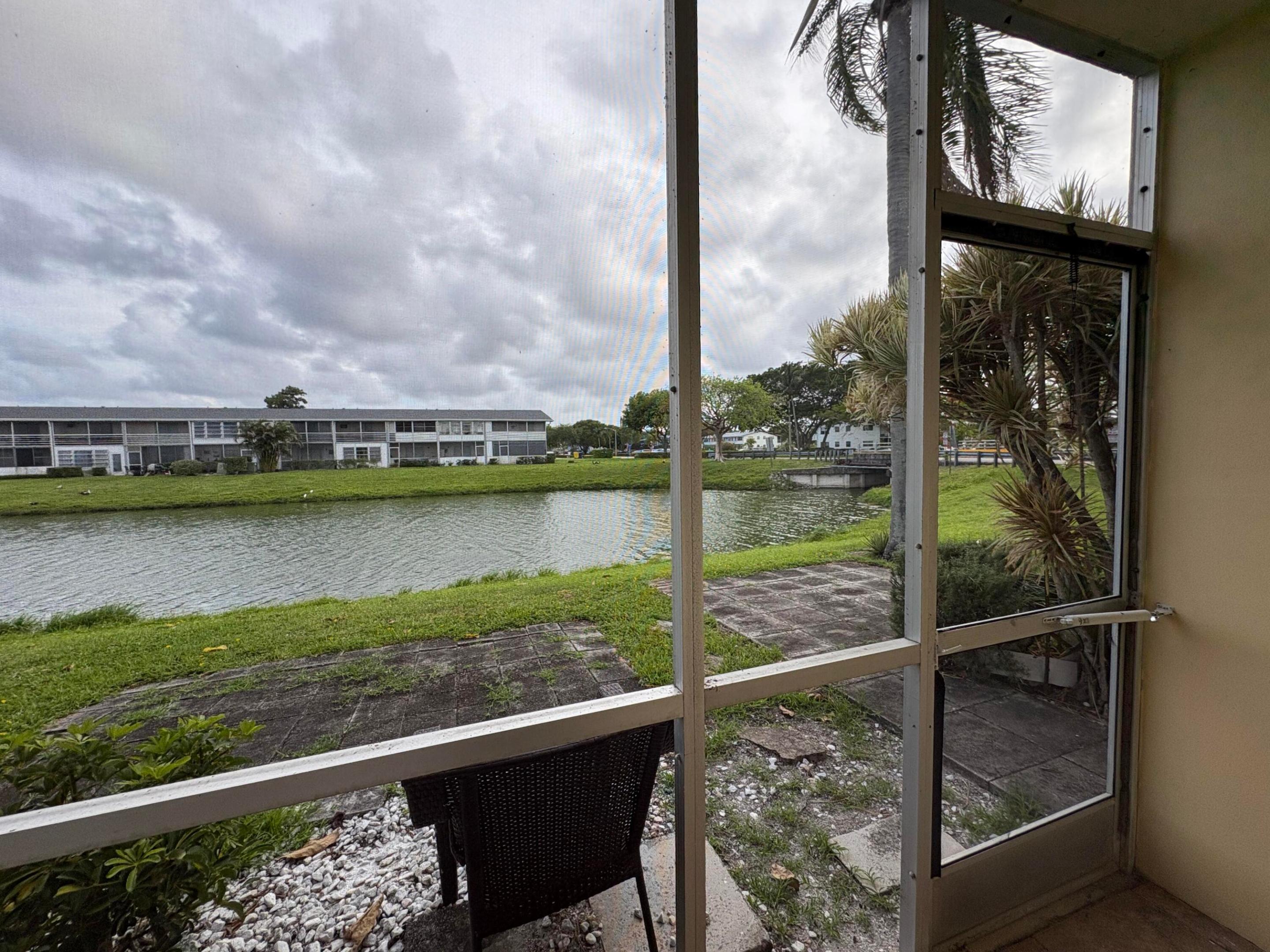Beautiful updated 1BR/1BA first-floor condo located in the desirable Kent section of Century Village! This charming unit features new tiled flooring, an updated kitchen with modern backsplash, and a peaceful smoke-free environment. Enjoy an extraordinary canal view from your personal back porch with convenient rear door access, perfect for relaxing mornings or fishing right outside your home. Quiet and tranquil 55+ community offering resort-style amenities including pools, tennis courts, clubhouse activities, fitness center, library, and entertainment.