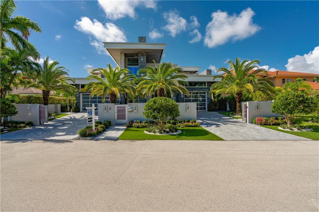 Exquisite modern estate built in 2016 on an oversized lot w/80' of deep water frontage, just moments by boat to the Intracoastal Waterway. All concrete & steel construction. Smart home features Lutron system, cameras, sound system, alarm & intercom. Vast, open kitchen w/oversized island, Subzero & Wolf appliances. elevator wine coolers, office, gym, cigar room, 2nd floor loft and 2 laundry rooms. Accent lighting throughout. Resort-style pool w/waterfall. Fantastic Las Olas ~ Seven Isles location.