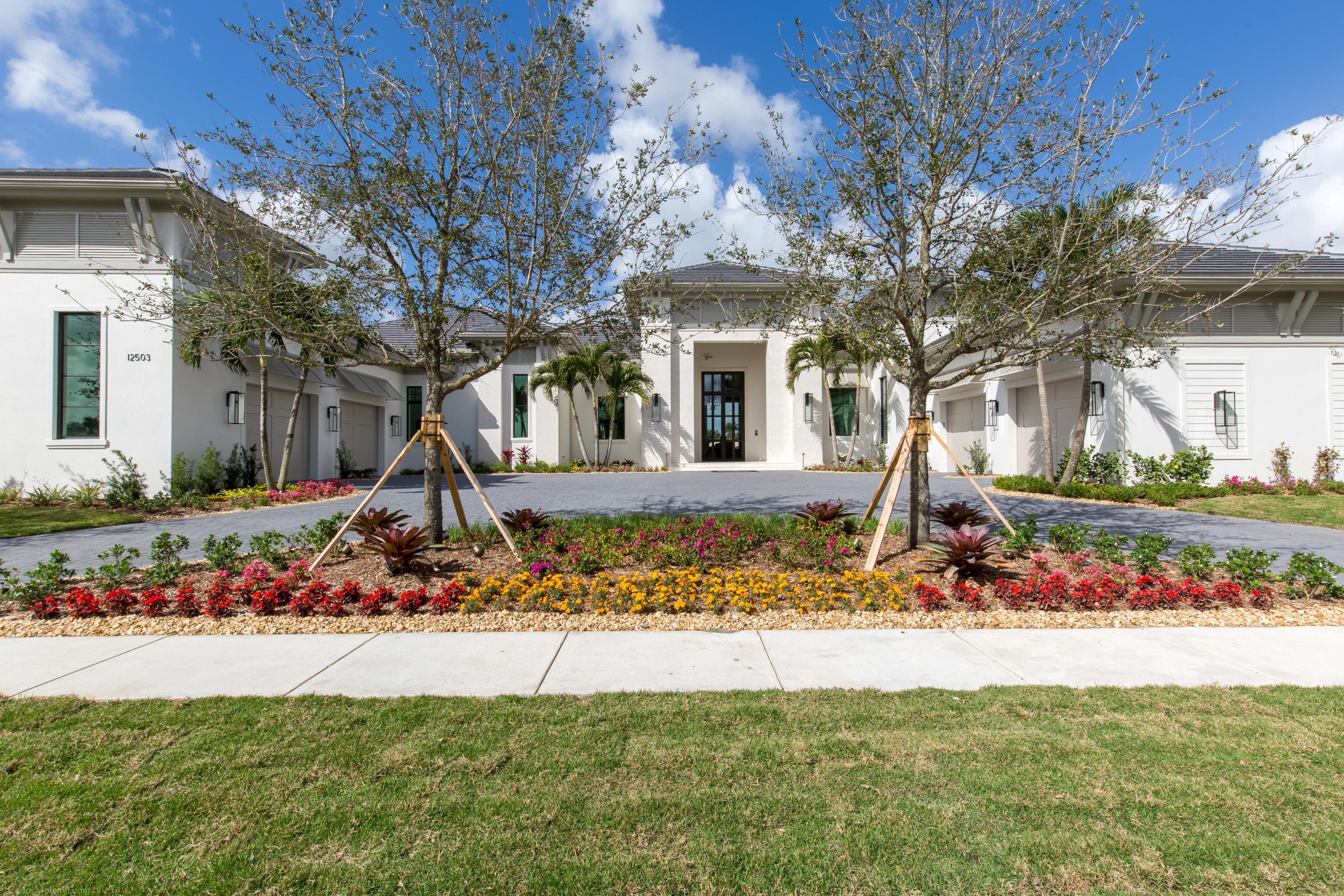 A one-of-a-kind remarkably designed new construction residence located in Cypress Island, hosting 4 bedrooms, 4 full and 2 half bathrooms with a four car garage.  Beyond the front doors lies a grand formal living space, featuring a fireplace and massive windows overlooking the pool.  Perfect for the entertainer, the floorpan easily flows from the formal living area to a full sized bar and seating area, featuring an impressive walk-in glass wine cooler, and beyond to a gourmet kitchen.  No expense was spared in crafting the state-of-the-art kitchen, offering copious amounts of storage & dining spaces.  Sliding doors open to an outdoor oasis, complete with a summer kitchen, dining and living space, beamed ceilings, as well as the resort-style pool & spa.