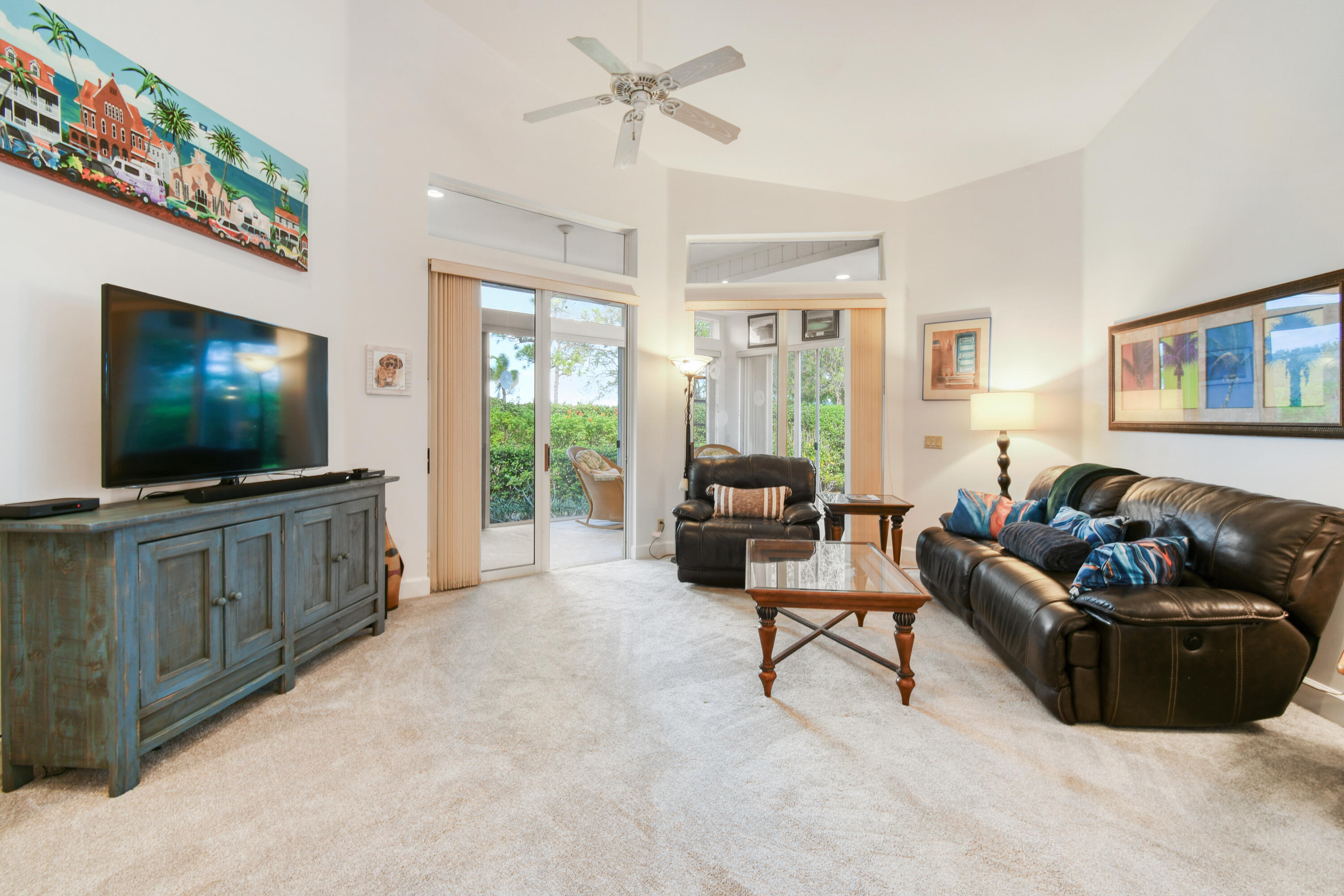 Mandatory $125,000 Membership Initiation Fee and Mandatory Annual Club Dues, HOA, POA, and Capital Contributions. Fairway Village is a charming and intimate enclave of just 27 single-family patio homes designed for comfort, privacy, and effortless living. Perfectly positioned on the largest lot in the village, this beautifully maintained one-story residence offers a rare blend of space, tranquility, and convenience. Spanning 1,946 A/C square feet, this 3-bedroom, 2.5-bath home features a highly desirable and expanded, split-bedroom floor plan, creating ideal separation between the primary suite and guest accommodations. The thoughtfully designed layout provides both functionality and privacy, making it perfect for everyday living as well as hosting family and friends.  The interior has been newly painted, creating a fresh and inviting atmosphere throughout the home. The updated bathrooms add a touch of modern comfort, while the motorized window treatments in the primary bedroom provide both convenience and a touch of luxury. Offered fully furnished, this home presents a truly turnkey opportunity for buyers seeking an easy transition into the Harbour Ridge lifestyle. Step outside and enjoy the peaceful setting of your beautifully landscaped privacy lot, offering a quiet retreat surrounded by mature greenery. The two-car garage provides ample storage and practicality with additional guest parking across the street. Residents of Fairway Village enjoy access to a community pool and outdoor kitchen, perfect for relaxing afternoons or casual gatherings with neighbors. Golf enthusiasts will especially appreciate the short walking distance to the community's golf practice facilities, making it easy to enjoy the game whenever inspiration strikes. Combining location, privacy, and turnkey convenience, this exceptional property represents a rare opportunity to own one of the most desirable homes in Fairway Village. Harbour Ridge is one of the most premier private club memberships in all of South Florida, which offers luxurious amenities for all of their members. Whether you enjoy golf, boating, kayaking, paddle boarding, fitness, tennis, pickleball, dining, bird watching, or embracing the natural surrounds of a Certified Audubon Cooperative Sanctuary, Harbour Ridge offers something for everyone. The club also prides themselves by providing their membership an unparalleled level of personalized service across all amenity venues to ensure the highest level of membership experiences throughout the club and community.