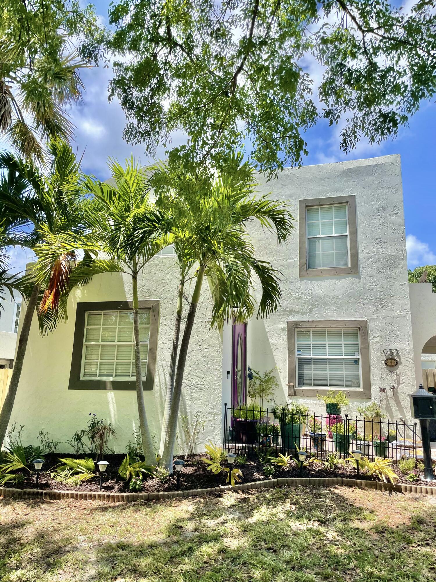 Exquisitely restored 1925 Mission Revival home in the sought-after Northwood Hills Historic District, designed by renowned architect Theodore Eissfeldt. No HOA!  Situated on a rare 10,436 SF double lot, this historic gem blends timeless charm with modern updates, including a new 2025 roof, updated electrical and plumbing, hurricane-rated front door, shutters, and EV charging. Features include a decorative tile fireplace, vintage crystal doorknobs, designer lighting, fully updated kitchen with granite countertops and stainless-steel appliances, and renovated baths. Enjoy a private tropical backyard with mature mango and avocado trees, room for a pool, RV/boat parking, labyrinth and rock garden.