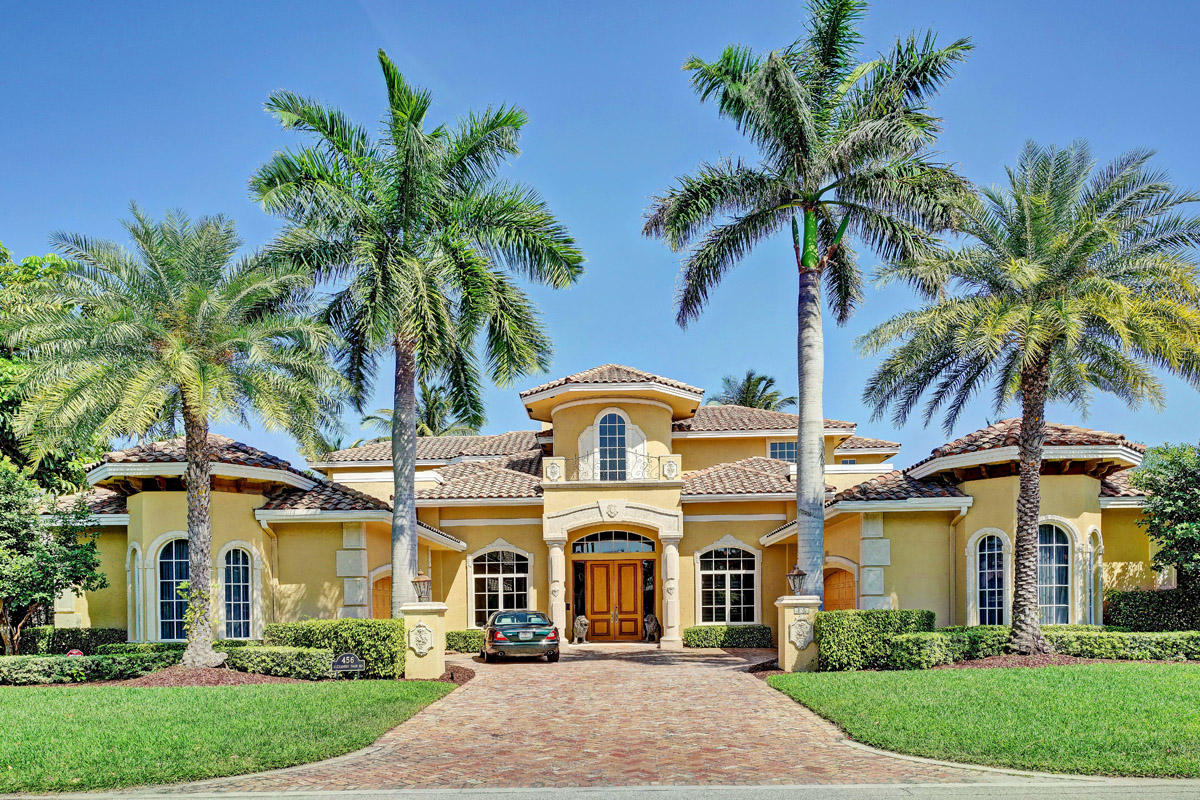 Intracoastal home on 104' of waterfront in Royal Palm Yacht & Country Club with 6 bedrooms, 8 and 1/2 bathrooms and a 4 car garage. All bedrooms on the 2nd floor have views of the Intracoastal Waterway with French doors leading out to a balcony, en suite bathrooms, and walk-in closets. Large master suite on the 1st floor features separate his and her bathrooms, his and her closets, and an exercise room with French doors leading out to the pool/patio area. Marble flooring throughout all main living areas, volume ceilings, formal living and dining rooms, private den/library, family room and breakfast area off the gourmet kitchen with views of the waterway, elevator, central vac and 4-zone air conditioning.
