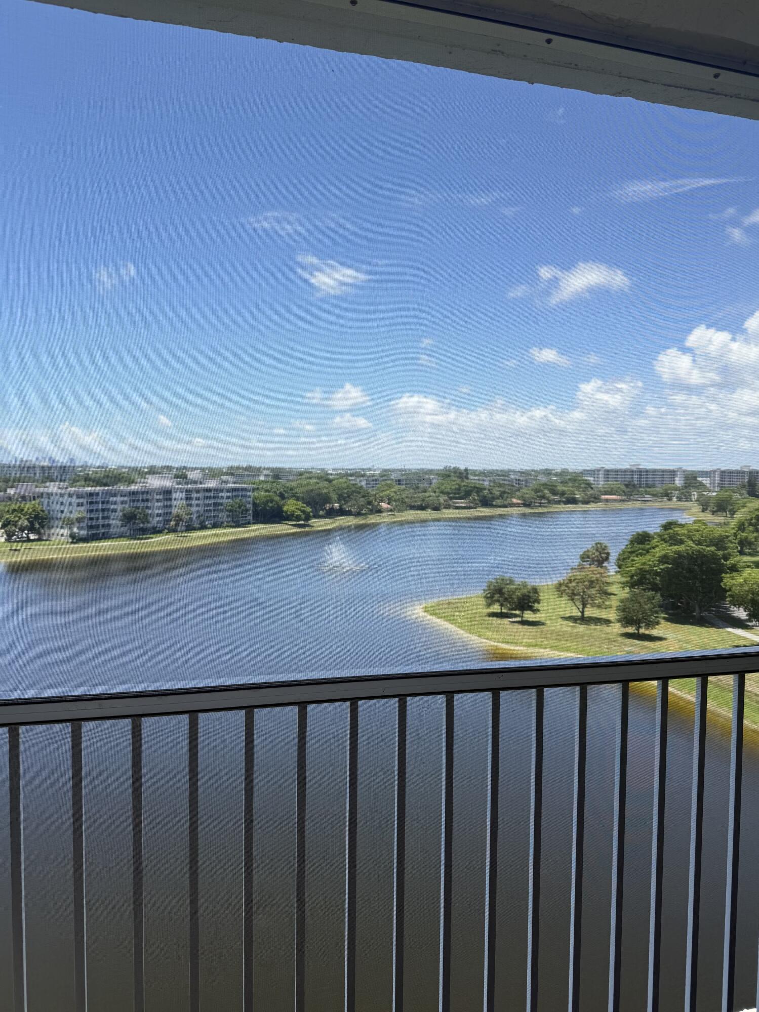 Well maintained Top Floor Condo overlooking a beautiful lake. Nice balcony with sliding glass doors off the living room. Eat in kitchen and dining area with living room combination.  2-bedroom, 2-bathroom condominium located in the Palm-Aire Country Club community. Offering 1,216 square feet of finished living space, this residence provides comfortable proportions. The split layout of two bedrooms and two full bathrooms ensures convenient living arrangements for various lifestyle needs. "AS IS" Carpet is Berber. Priced to sell! "AS IS"  Building number #53