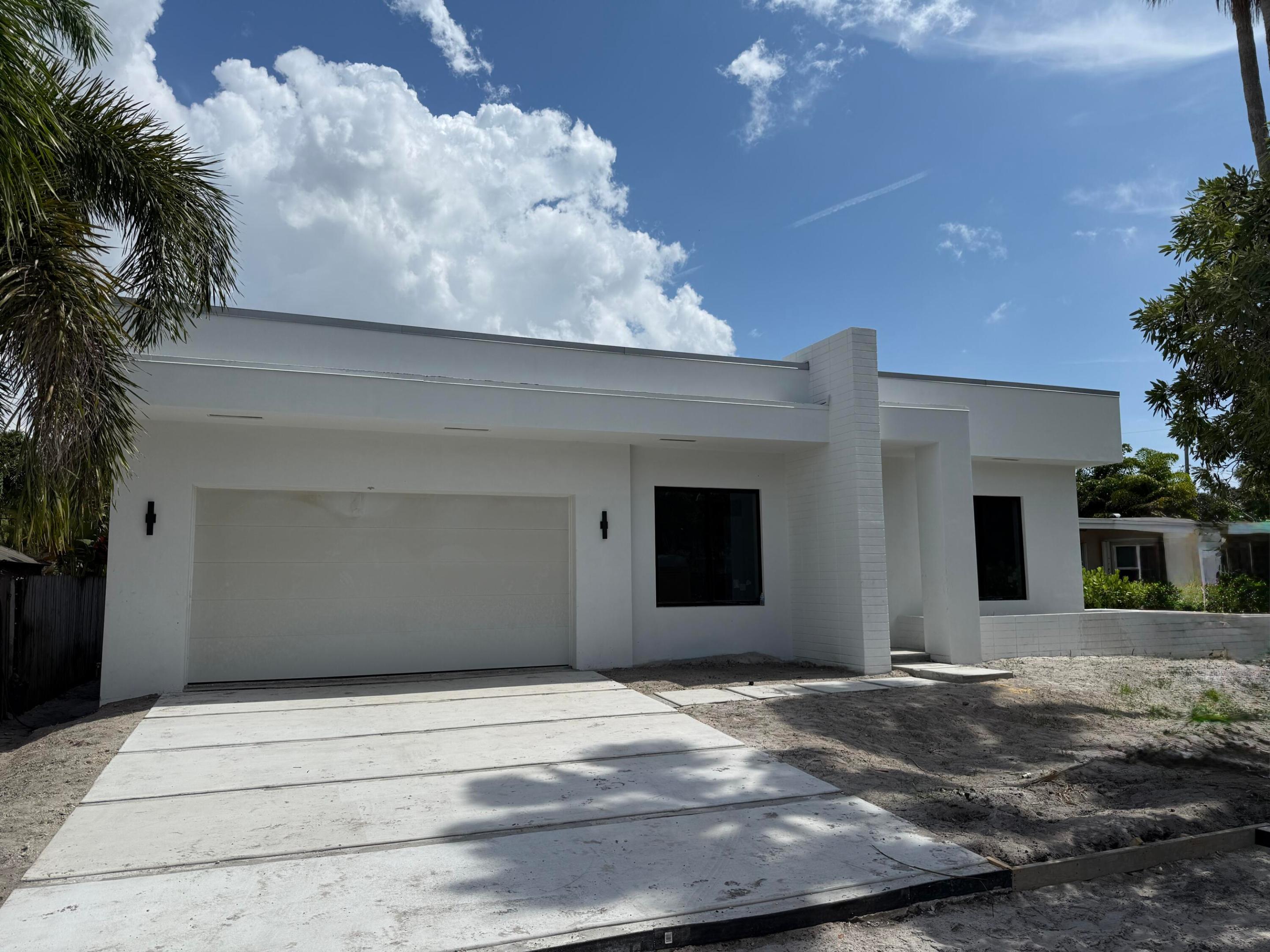 New construction with classic mid-century design delivering in Q3 of 2026. This perfect Florida lifestyle home features 3 bedrooms, 3 bathrooms plus a separate office, 11' and 10' ceilings, an open floor plan and walls of glass that open up to a huge outdoor patio/pool including a covered patio with TV hookup. The kitchen boasts a massive island, Thermador appliances and a walk-in custom pantry. Opening up to the pool and patio, the main suite features a custom walk-in closet and full marble bath with double headed shower and free-standing tub with TV hookup for a true spa experience. In addition, there is also a dedicated office and two guest bedrooms. Just blocks from Federal Hwy, enjoy walking to grocery, shops and restaurants.