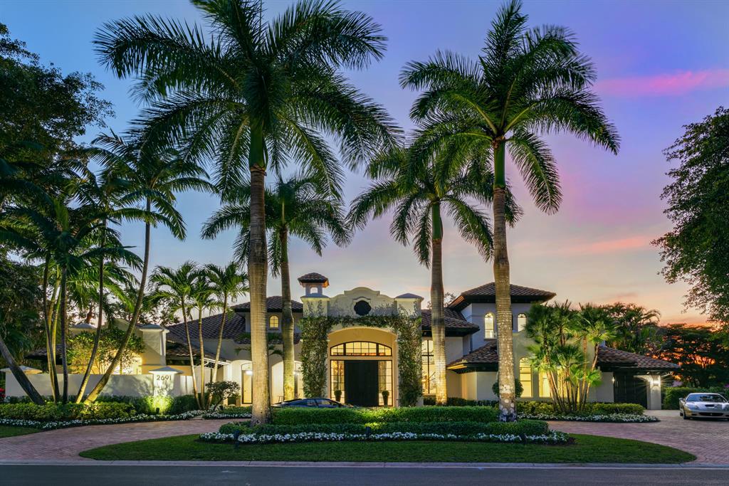 This spectacular Mediterranean Revival estate has been completely reimagined into a mid-century modern, black and white/tonal masterpiece. This icon reborn encompasses 6,163 sq. ft. of living space with 6 expansive bedrooms, 6 full marble bathrooms, library and a climate controlled 4-car collectors garage. Offering seamless indoor/outdoor living with serene views, the outdoor living space includes a beautiful limestone deck, spacious pool and spa, a covered seating area with a summer kitchen shrouded in Panda Marble and a charming coffee courtyard. The stunning interior boasts soaring 20' ceilings, magnificent marble throughout including a walk-in wine room and a 20 foot book-matched and honed Glacier Marble fireplace feature wall. The dramatic black kitchen offers dual-seated waterfall honed Nordic Marble islands, peninsula and countertops with Italian matte glass hardware throughout. The luxurious master suite includes a sitting room with bay windows overlooking the pool and an expansive 900 sq ft en suite bath with black vessel sinks, dual 12 inch Italian rain showers, relaxation or gym area and a spa tub with its own private garden with night lighting.  Encompassing the home's second floor is a marble morning kitchen with wine cooler, servicing the 4 guest bedrooms as well as the spectacular 600 sq ft limestone Westerly Sunset Balcony. Ideally situated within the private gates of the Palm Beach Polo Golf and Country Club, this custom estate is the perfect embodiment of luxurious living in stylized space. Being offered turnkey furnished.