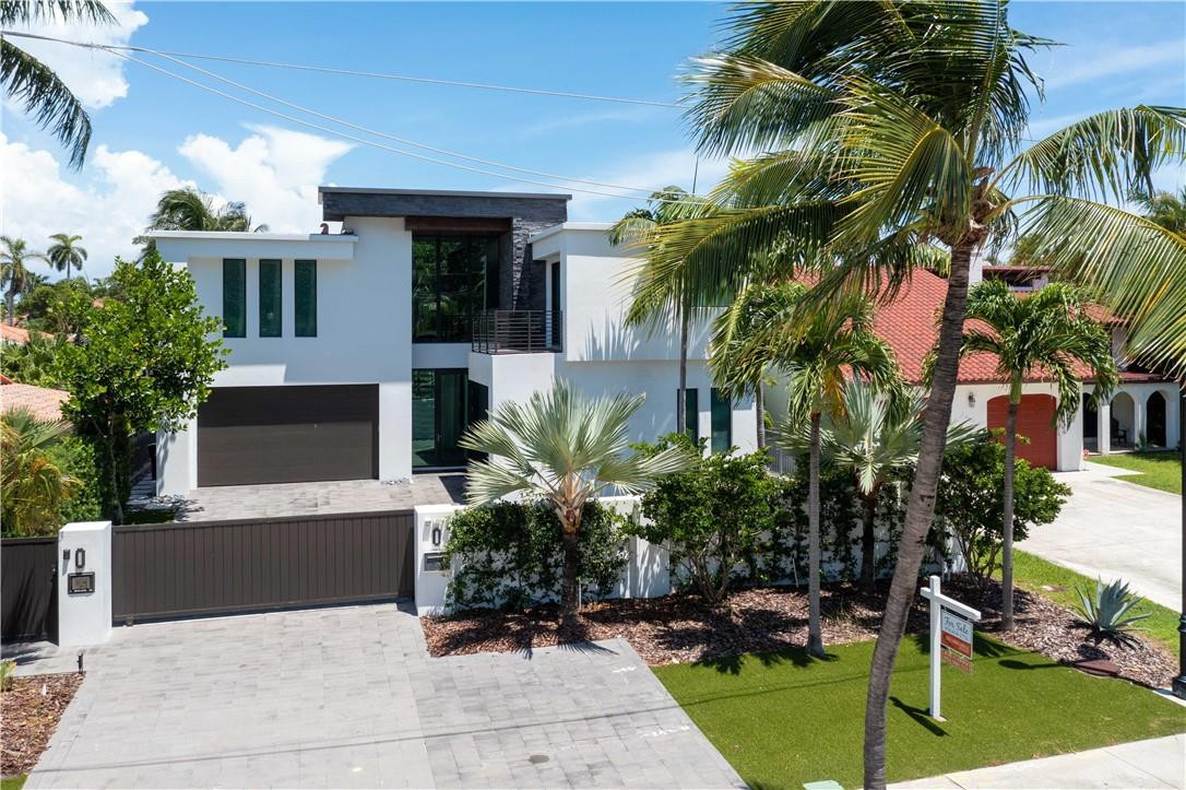 Stylish, Sophisticated and Polished Best Describes this Las Olas Modern Contemporary Waterfront Home! Located next to the Beach, Shops and Restaurants. This DEX Homes creation is the best of all worlds.  Professionally decorated 5/5, 3CG home has 6504 sf of luxury. All bedrooms upstairs are en suites with custom closets. Finest finishes such as - gorgeous porcelain & wood floors, wood ceilings, sleek kitchen and bars with exotic quartz countertops, smart home, elevator, brand new generator. Great entertaining areas, and much more!For the avid boater this waterfront home boasts 60+/-  ft dock with a 35k lb boat lift. All of this just a stones throw away from the Intercostal with no fixed bridges and ocean access within a few minutes!
