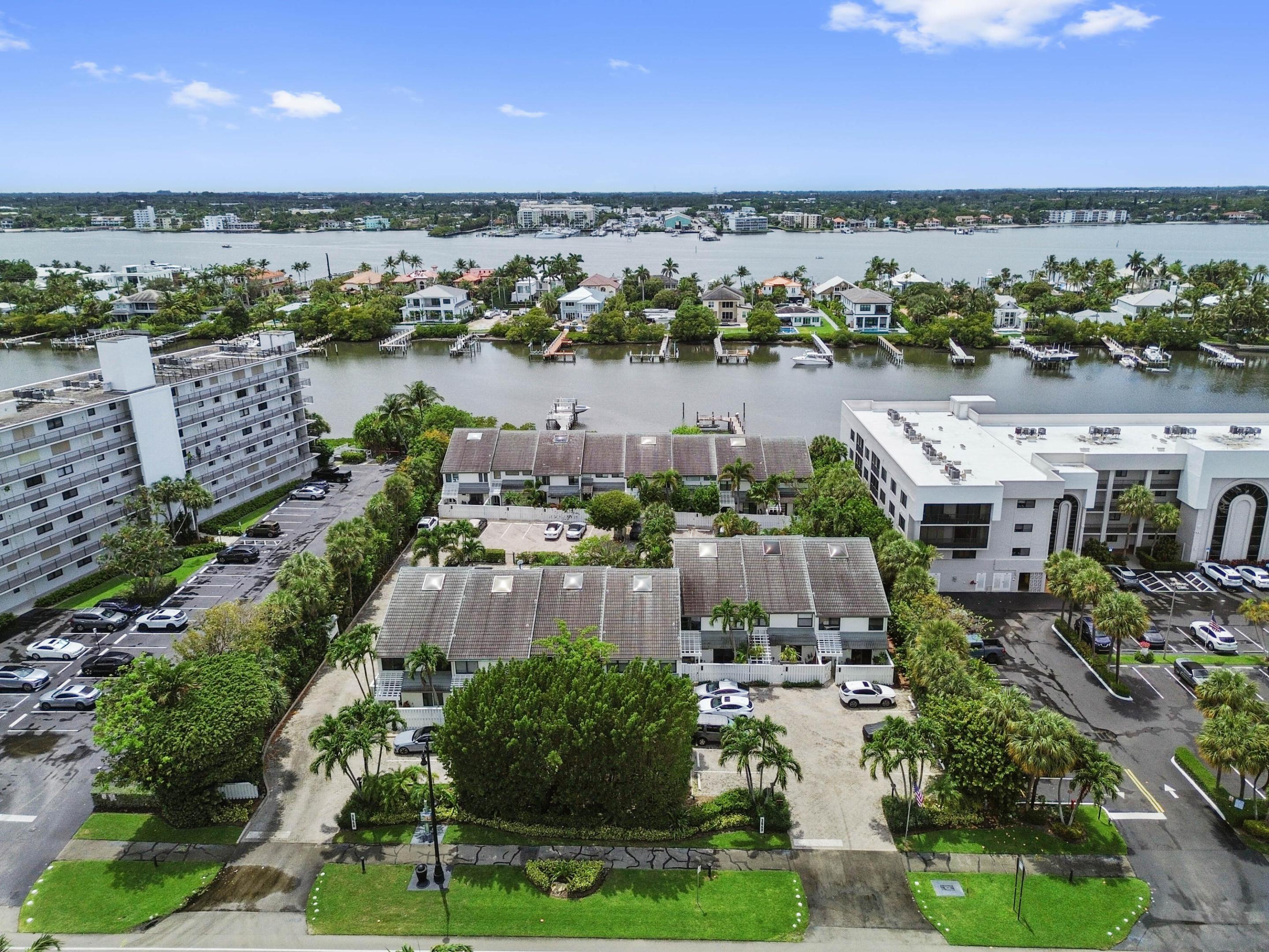 Tucked away in the charming waterfront community of South Palm Beach, this beautifully designed two-story residence at 3543 S Ocean Boulevard #111 offers the perfect blend of coastal comfort and private retreat living. Just moments from both the Atlantic Ocean and Intracoastal Waterway, the home welcomes you with spacious open-concept living areas, abundant natural light, and a seamless indoor-outdoor flow that captures the relaxed elegance of Palm Beach living. Private gated front and rear patios create inviting spaces for morning coffee, evening entertaining, or simply enjoying the ocean breeze Inside, the thoughtfully designed layout features a fully updated kitchen with one-of-a-kind quartzite countertops, 2 generously sized bedrooms with renovated ensuite bathrooms, a guest bedroom & a den space that can be converted to a bedroom, multiple outdoor living areas, and a bright second-floor balcony overlooking the lush tropical surroundings. The corner-unit location enhances both privacy and natural light, while the tranquil setting beside the community pool creates a true resort-style atmosphere. Skylights, spacious living areas, and timeless architectural details add warmth and character throughout the home, making it equally suited as a full-time residence, seasonal escape, or investment opportunity.   Located along prestigious South Ocean Boulevard, residents enjoy easy access to pristine beaches, boating with community docks that allow boat parking, waterfront dining, and the sophisticated lifestyle Palm Beach is known for. With community marina access, tropical landscaping, and the rare combination of privacy and convenience, this residence captures the essence of effortless coastal living. Whether you're seeking serene seaside mornings or vibrant evenings by the water, this hidden gem delivers an exceptional South Florida lifestyle in one of the area's most desirable oceanfront corridors.