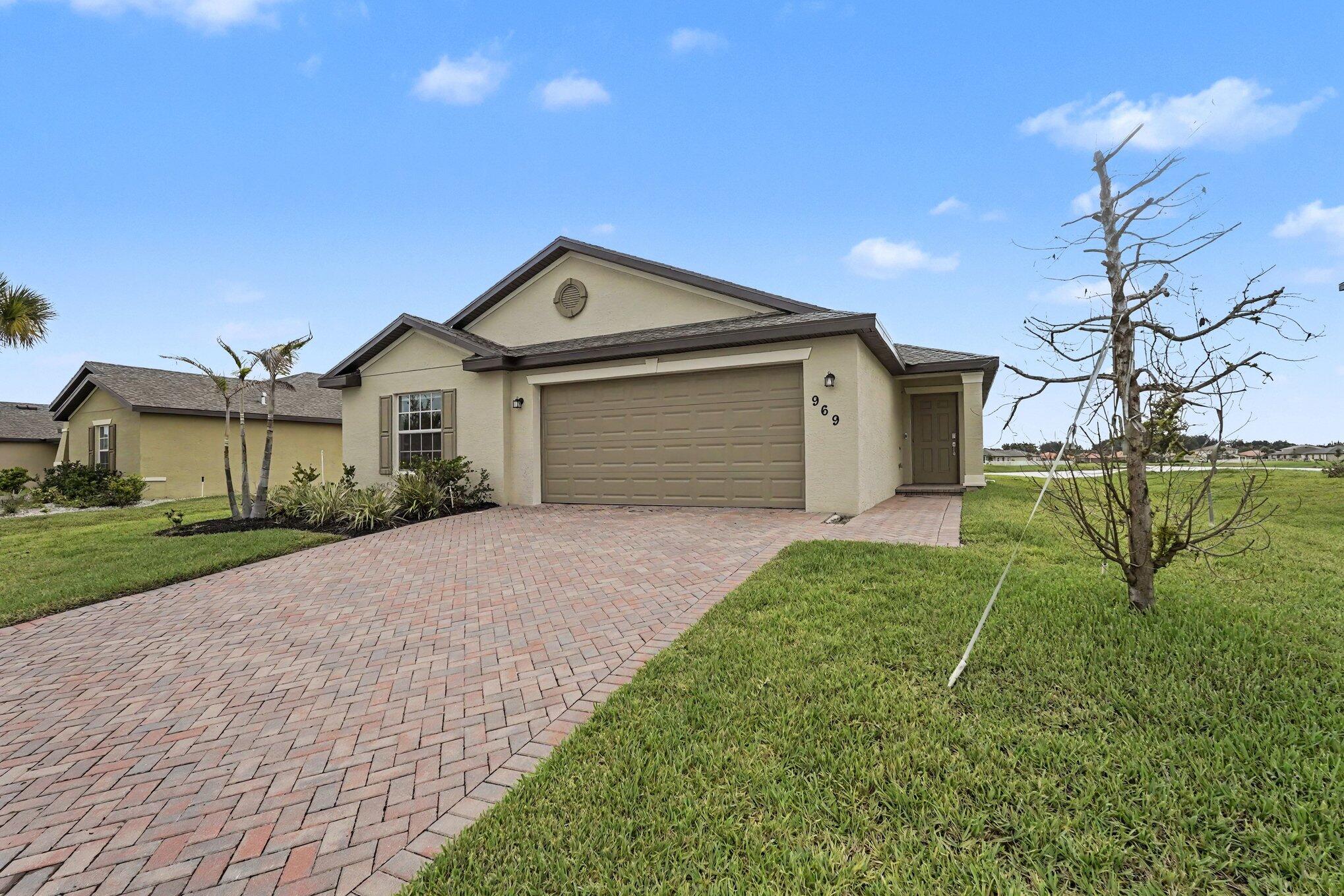 Discover this 4-bedroom, 2-bathroom single-family residence in Bent Creek Tract A-2, Fort Pierce, offering 1,814 square feet of finished living space on one level. The home features a 2-car garage for convenient parking and storage. Situated on a waterfront property, this residence provides direct access to the water's edge. The open floor plan and practical layout make efficient use of the generous square footage, accommodating both everyday living and entertaining. Located in the established Bent Creek Tract A-2 community, this property presents an excellent opportunity for those seeking waterfront living Gorgeous sunrises from your own back porch, in Fort Pierce. Close to I-95, shops and restaurants. **PLEASE CALL AGENT FOR GATE ACCESS**