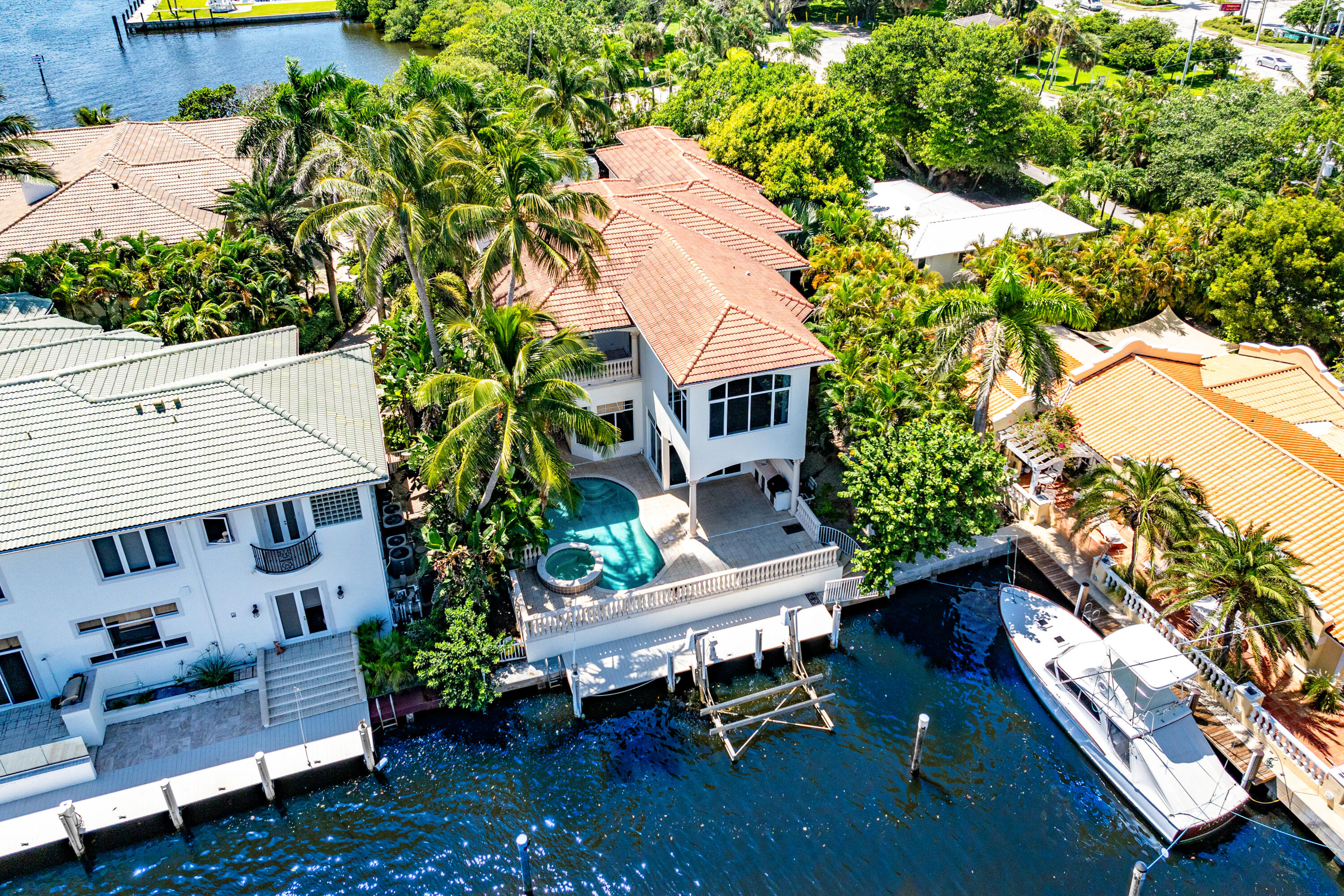 Introducing A Crown Jewel Waterfront Mediterranean Estate an unparalleled masterpiece of elegance and seclusion. This exclusive residence, boast 55ft of prime water frontage on an oversized 90ft canal (2x a standard size canal width) with direct access to the main intracostal immediately after leaving your private dock. Nestled within a tranquil cul-de-sac in the prestigious Rio Delray community, offers a private sanctuary behind its own gated entrance. Presenting a stately and magnificent six-bedroom residence, a true European-inspired masterpiece spanning 7,307 +/- square feet, crafted to fulfill the desires of the distinguished South Florida lifestyle.

Designed and built with masterful precision by Garcia Brenner Stromberg and Millennium Builders, this estate is adorned with luxurious appointments, including exquisite walnut millwork, classical moldings, intricate designer ceiling embellishments, and gracious archways supported by elegant stone columns. The interiors are graced with a selection of opulent flooring, from honed Saturnia marble to rich wide-plank wood and plush carpeting, creating a symphony of texture and refinement. Upon entry, the home's splendor unfolds through double glass doors, leading to a grand foyer, stair hall, and elevator vestibule, where each space evokes a sense of elegance, grace, and drama. The formal living spaces are crafted to inspirean enchanting living room, crowned with a gas fireplace and an intricately carved stone mantel, opens to a serene patio through French doors, while the intimate dining room, framed by graceful ogee-curved niches, reveals a glass wall that gazes upon a tropical pocket garden.
A richly appointed library, with an ensuite half bath, boasts walnut built-in bookcases, a wet bar, and a wine fridge, offering a sophisticated retreat. The more casual living areas, designed with an open floor plan, revolve around the family room, where vast glass sliding doors invite the outdoors in, leading to the waterview pool deck. Adjacent, the breakfast nook is set in a charming bay, while the grand kitchen features professional-grade appliances, antiqued wood cabinetry, granite countertops, and a pantry fit for the finest culinary endeavors.
Ascend to the upper level to discover the palatial primary suite, where a private balcony offers sweeping views of the tranquil waters. This sanctuary is complete with a morning bar, two custom-fitted closets, and a spa-inspired bathroom adorned in granite, with dual sinks, a separate water closet, a glass-enclosed walk-in shower, a luxurious spa tub, and yet another gas fireplace. The second floor further hosts five guest bedrooms, one of which opens to its own private balcony.
The estate's thoughtful design extends to its practicalities, including a cabana bath, a well-equipped laundry/utility room, and an attached three-car garage. Among its many modern amenities are impact windows and doors, four air-conditioning units, two new tankless hot-water heaters, a full-house water purification system with reverse osmosis, new pool equipment, propane gas, and a central vacuum system. Notable recent updates include elegant new exterior bannisters and a state-of-the-art Generac full-house generator, ensuring comfort and peace of mind.
Just a mile south of the dynamic Atlantic Avenue in Downtown Delray Beach, you'll be immersed in a world of vibrant arts, world-class dining, and unparalleled entertainment. Located just one lot off the point, this estate not only delivers breathtaking water vistas but also ensures the ultimate protection for your waterfront and boat. Experience a seamless fusion of dramatic beauty and refined luxury in your own private oasis.