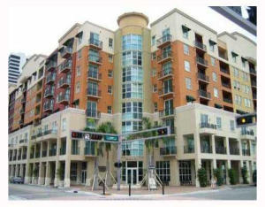 Right out of Architectural Digest, this fabulous 2 bedroom, 2 bath condominium is simply spectacular with an extra large balcony, great storage room, covered parking in a full service building with doorman, valet parking, fitness and business center. Well located in the heart of the city, this beautifully appointed home has numerous upgrades from the hardwood flooring, to the exquisitely upgraded kitchen with stainless steel appliances, granite counters, sparkling glass doors to an oversized balcony for elegant entertaining, and sparkling bathrooms with marble accents. Among the numerous features parking on the same floor and an extended storage unit.  The pristine condition and elegant presentation of this condominium will 'wow' you!
