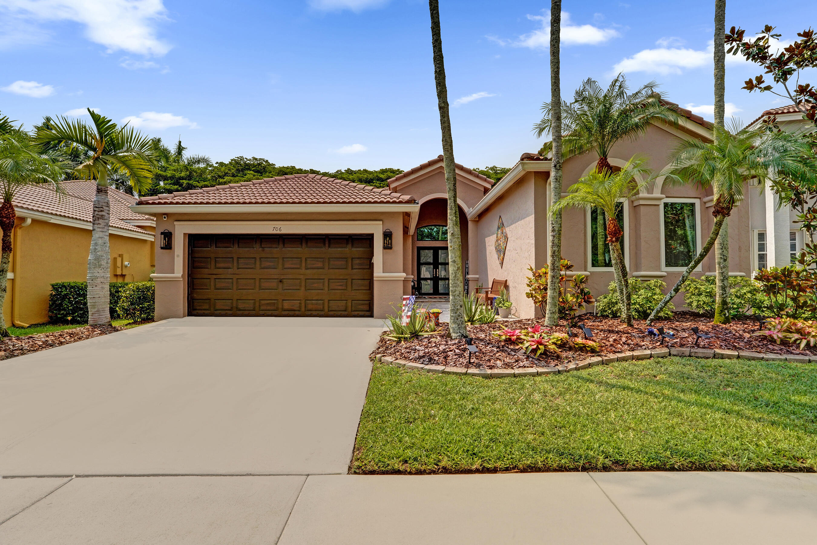 ONE STORY, Turn-key and move-in ready for summer buyers looking to settle in before school starts—NO REMODELING NEEDED! This beautifully updated home features an open space design, centered around an amazing kitchen that has solid wood diamond brand cabinetry with soft-close drawers, undermount lighting, MASSIVE center island, stunning Cambria countertops, a farmhouse sink and high-end Samsung appliances. FULL IMPACT WINDOWS/ DOORS (2020), A/C (2017). Interior features include long plank porcelain wood-look flooring, ALL BATHROOMS REMODELED! ADDITIONAL IMPORTANT UPDATES include WHOLE HOUSE WATER FILTRATION SYSTEM by Culligan, 2016 water heater, newer gutters, NEW lush carpet in primary. The attic has been professionally insulated w/ Icynene open cell spray foam for energy efficiency.  2026 washer and dryer. EXTERIOR features professional landscape design, travertine marble in front entrance, Tahoe marble on back patio. NO REAR NEIGHBORS. ROOF professionally maintained providing years of life left!