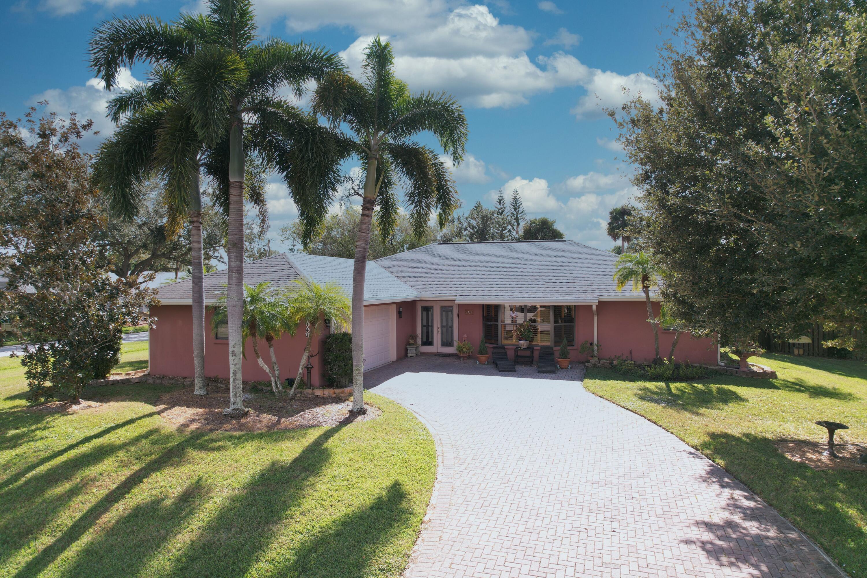 Welcome to your tropical oasis on estate lot! Peaceful surroundings yet close to amenities. Roof 2021, garage door 2025, Newer water heater and AC. This solid built 3 bedroom 2 bath home built with entertaining n mind.                                               You must see this home to really appreciate what it offers.
